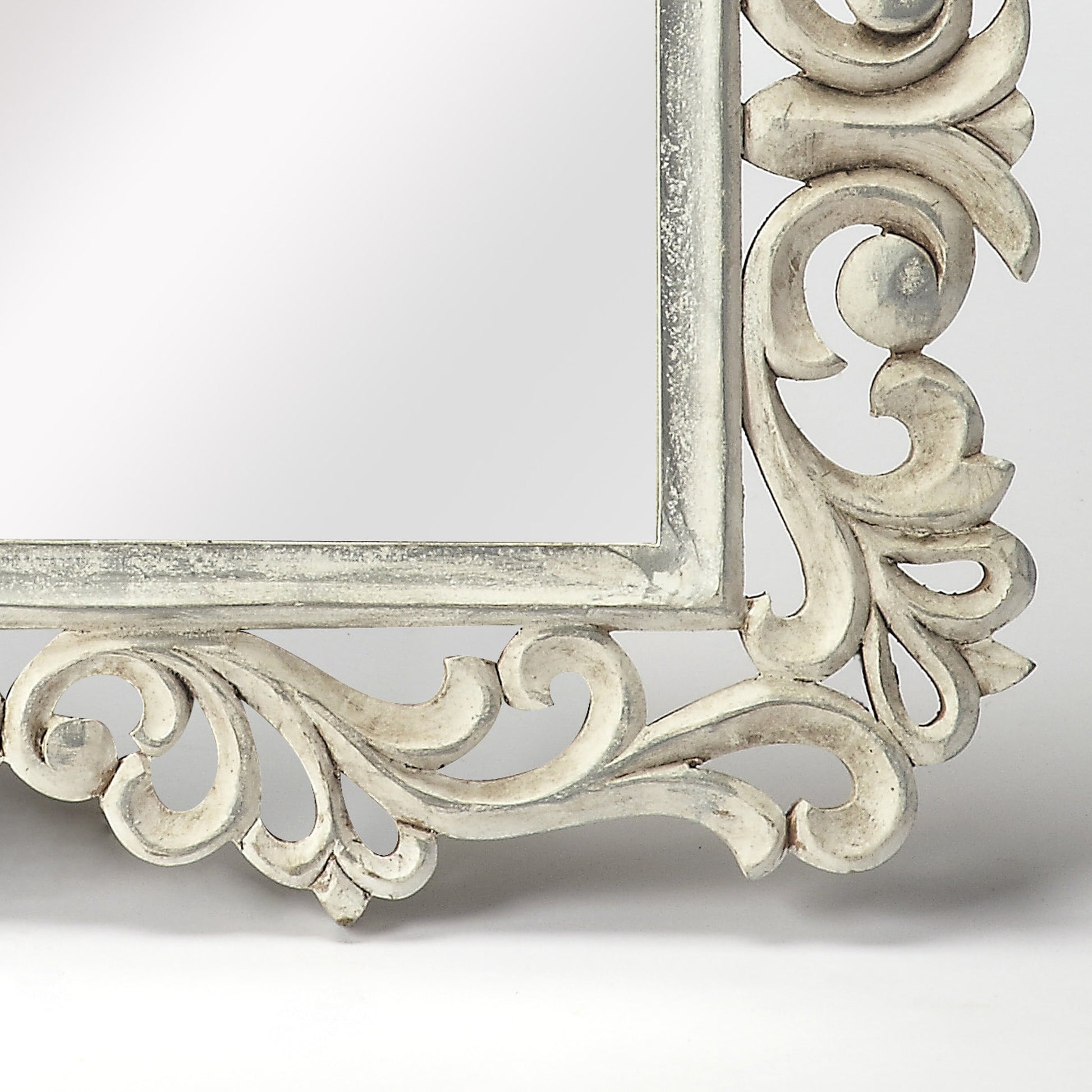 Favart Carved Wall Mirror by Butler Specialty Company in white and artifacts. Made from mdf, mirrored glass in a traditional style.