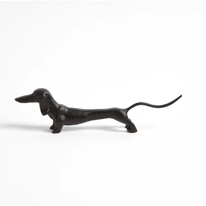 Dachshund Hound Sculpture by Global Views in bronze. Made from cast iron in a eclectic & global style.