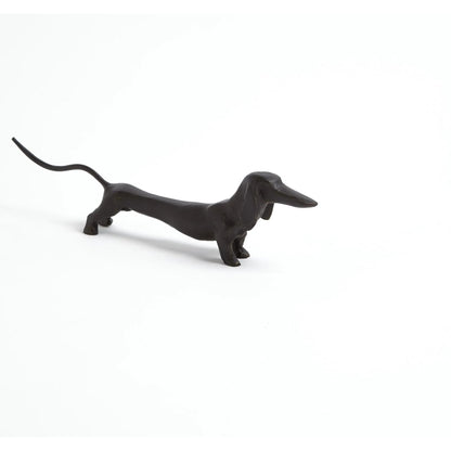 Dachshund Hound Sculpture by Global Views in bronze. Made from cast iron in a eclectic & global style.