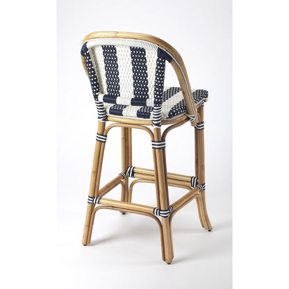 Lila Rattan Bar Stool by Butler Specialty Company in blue and blue. Made from rattan, plastic weave in a coastal style.