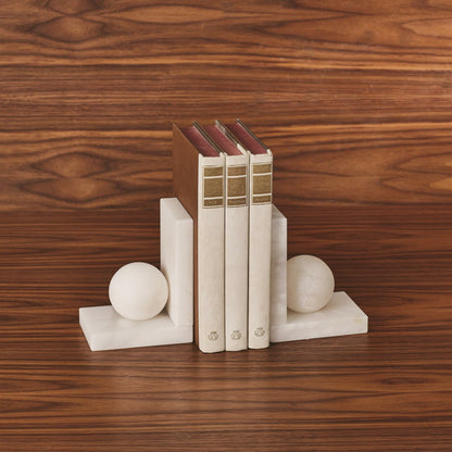 Alabaster Ball Bookends by Global Views. Made from alabaster in a modern style.