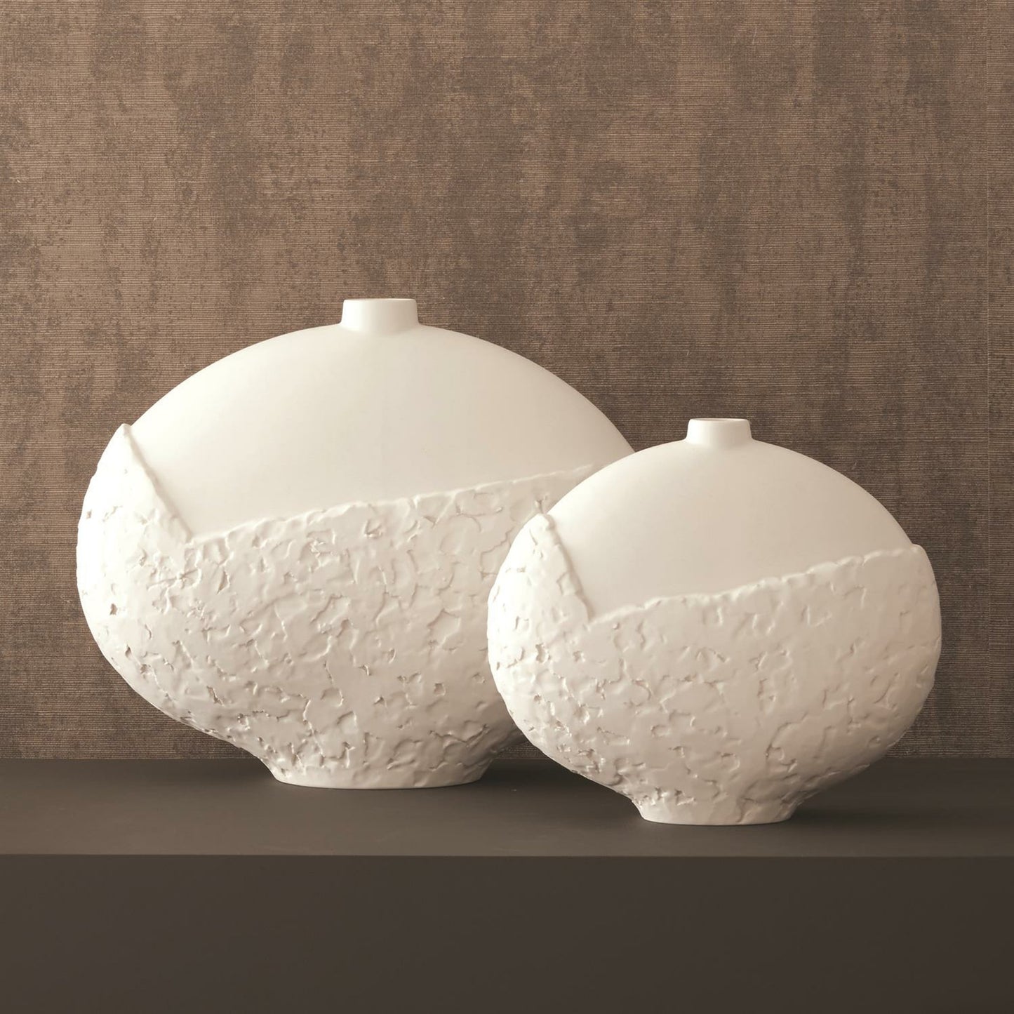 016 SR-890495,SR-890496 | Lifestyle | Asymmetrical Stipple Vase by Global Views in matte white. Made from ceramic in a coastal style.