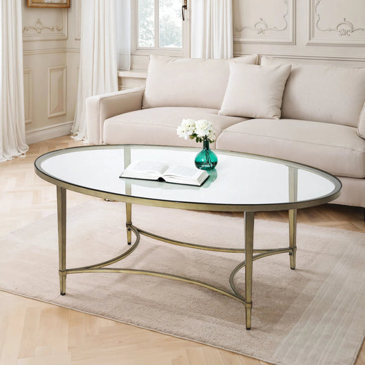 Monica Coffee Table by Butler Specialty Company in gold and antique gold. Made from metal tubing, tempered glass in a modern style.