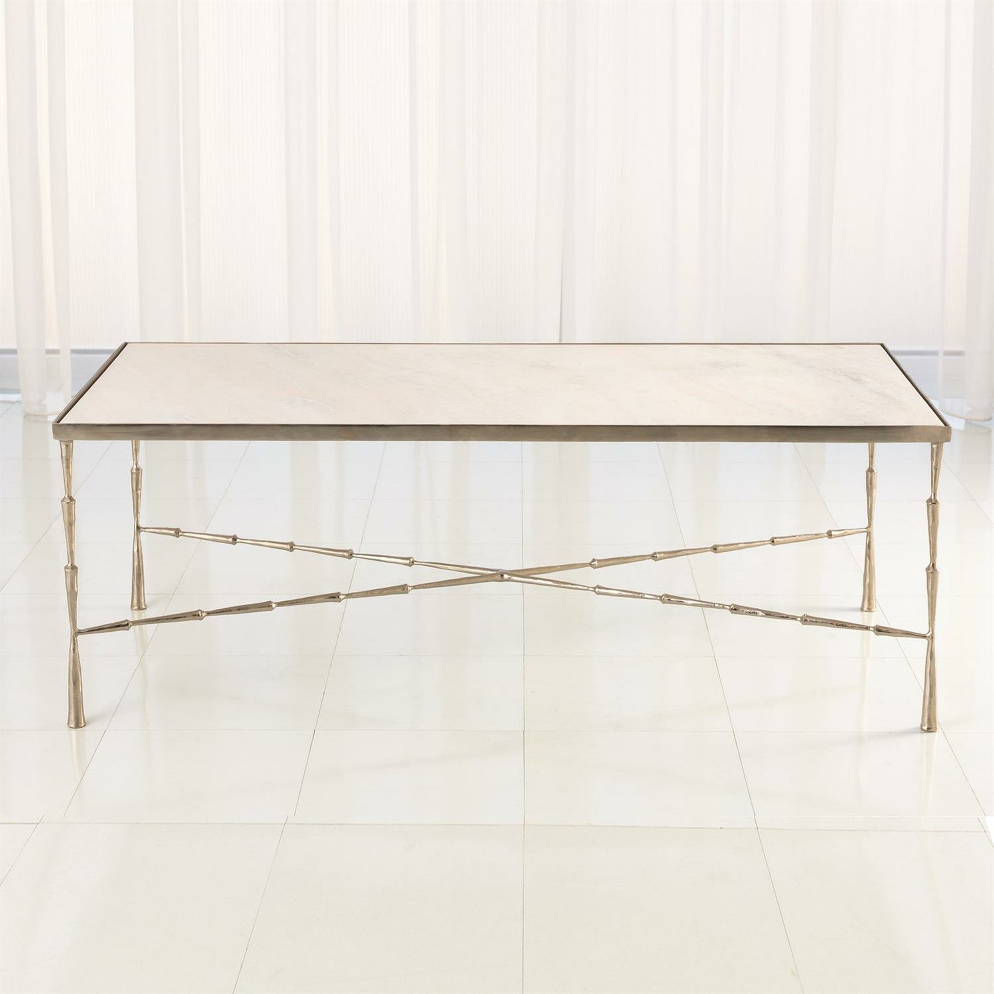 Spike Cocktail Table by Global Views in antique brass. Made from iron, marble in a transitional style.