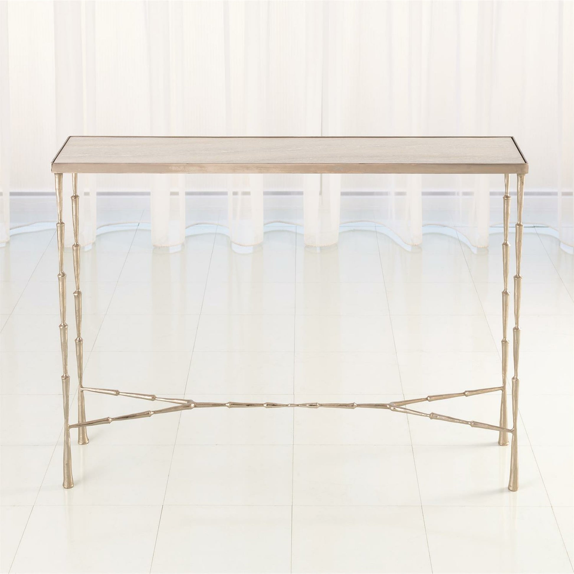 Spike Console by Global Views in antique brass. Made from iron, white marble in a transitional style.