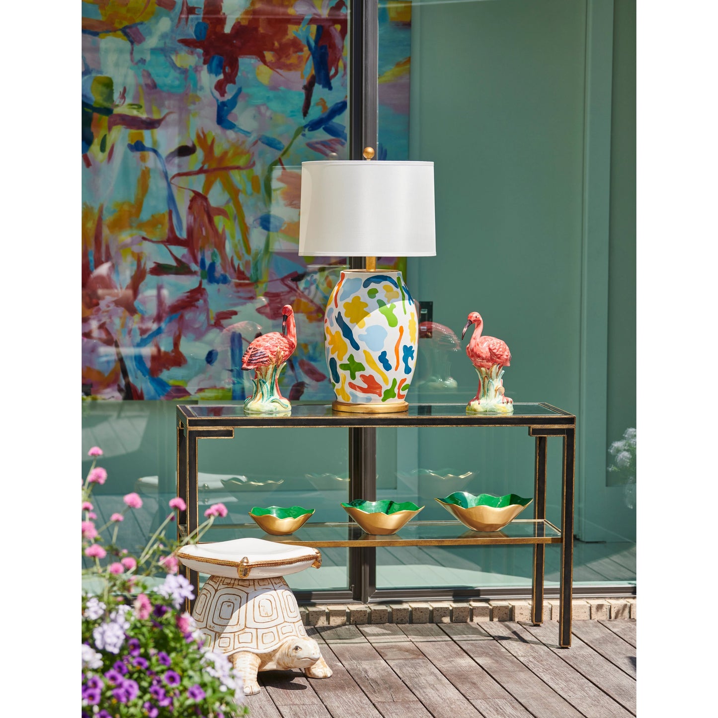 007 SR-382465 | Lifestyle | Decker Console by Chelsea House in old gold trim-black frame. Made from glass top in a transitional style.
