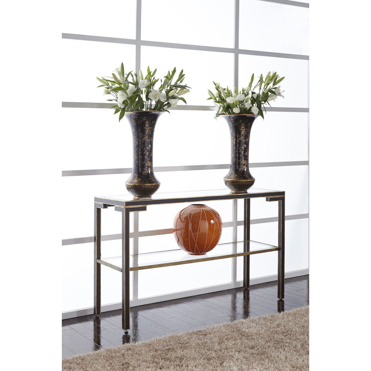 006 SR-382465 | Lifestyle | Decker Console by Chelsea House in old gold trim-black frame. Made from glass top in a transitional style.