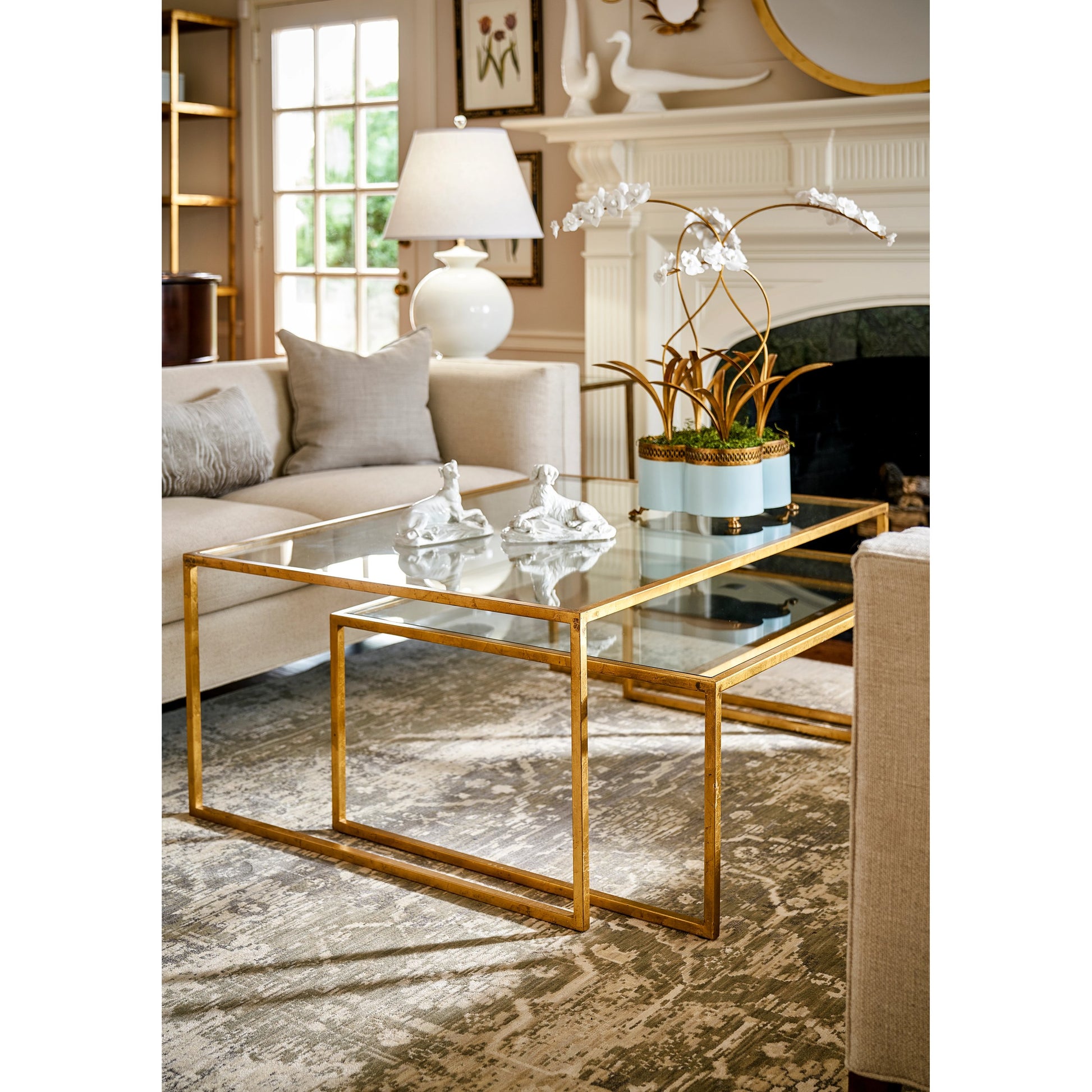 Nested Cocktail Tables by Chelsea House in gold leaf, clear. Made from gold leaf finish - iron in a modern style.