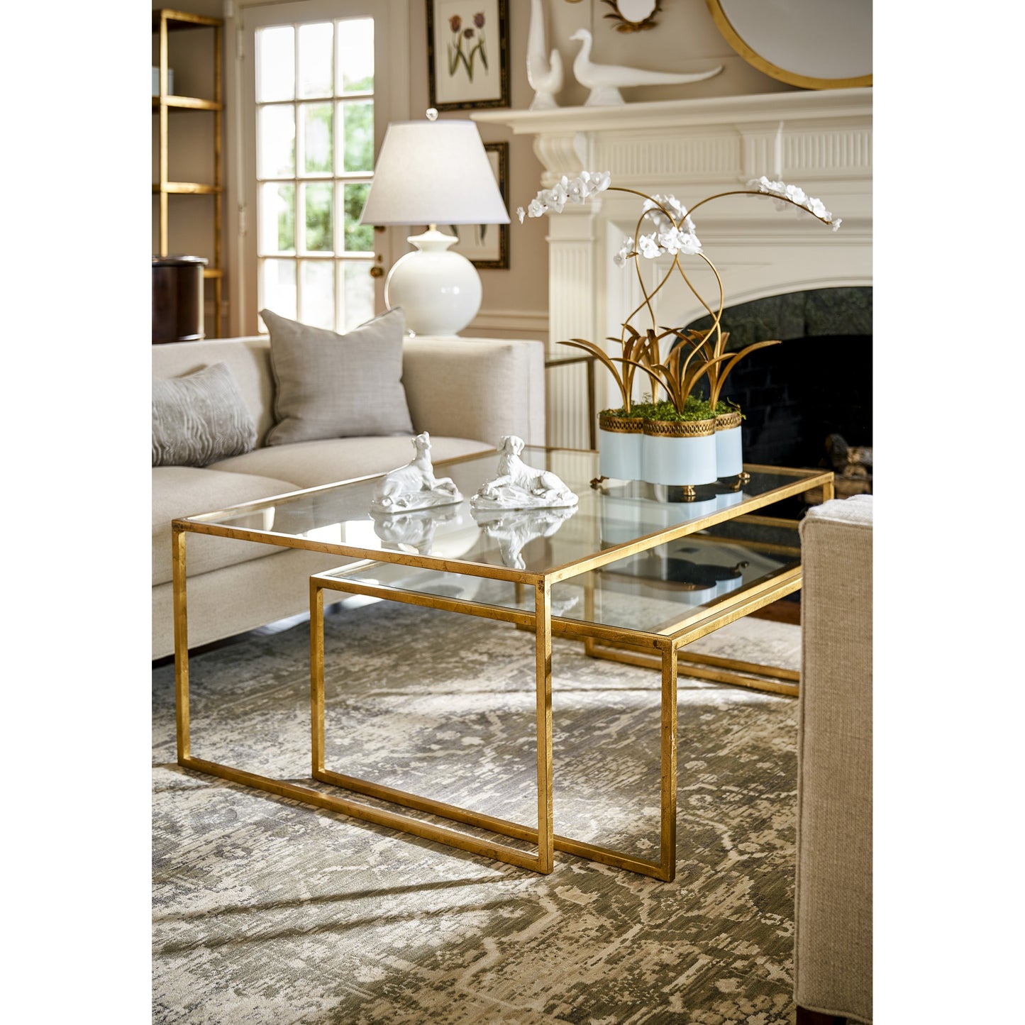003 SR-383377 | Lifestyle | Nested Cocktail Tables by Chelsea House in gold leaf, clear. Made from gold leaf finish - iron in a modern style.