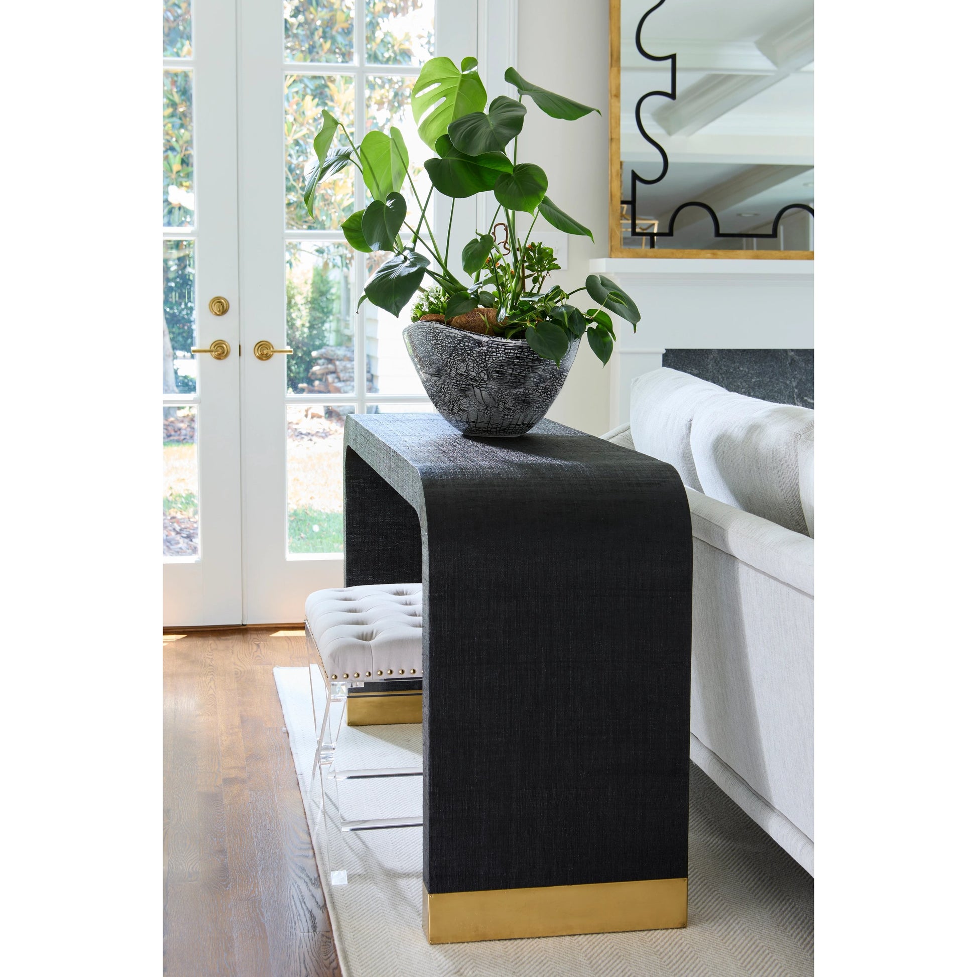 Waterfall Raffia Console by Chelsea House. Made from raffia, brass in a modern style.