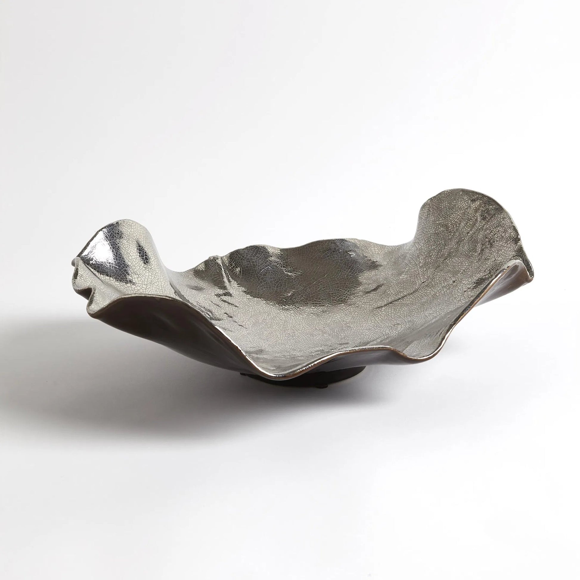 Wave Platter by Global Views. Made from ceramic in a eclectic & global style.