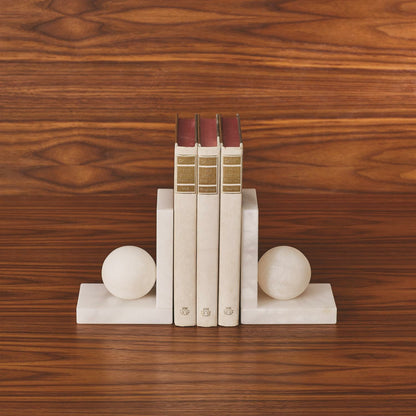 Alabaster Ball Bookends by Global Views. Made from alabaster in a modern style.