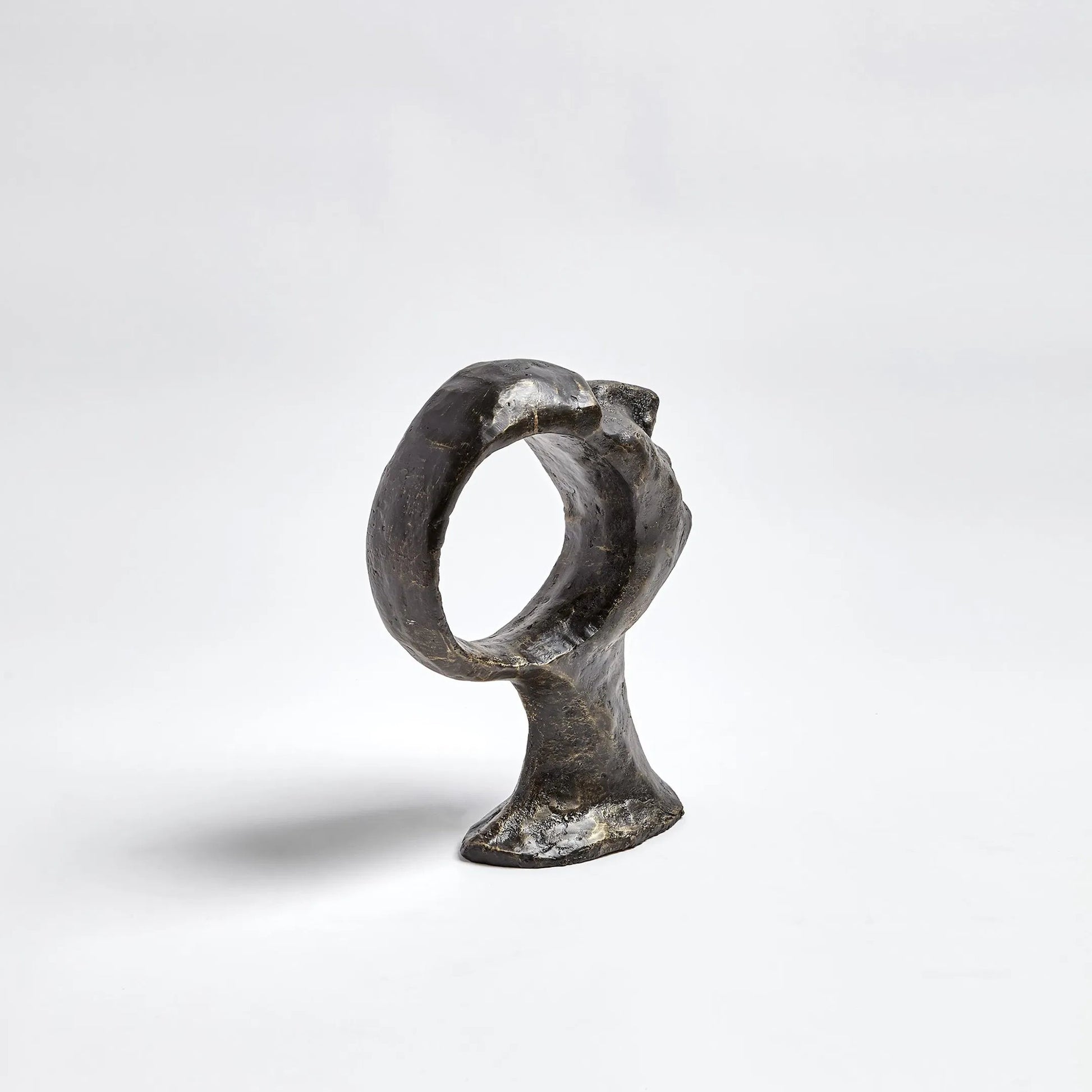 Hollow Head Man by Global Views in bronze. Made from iron in a eclectic & global style.