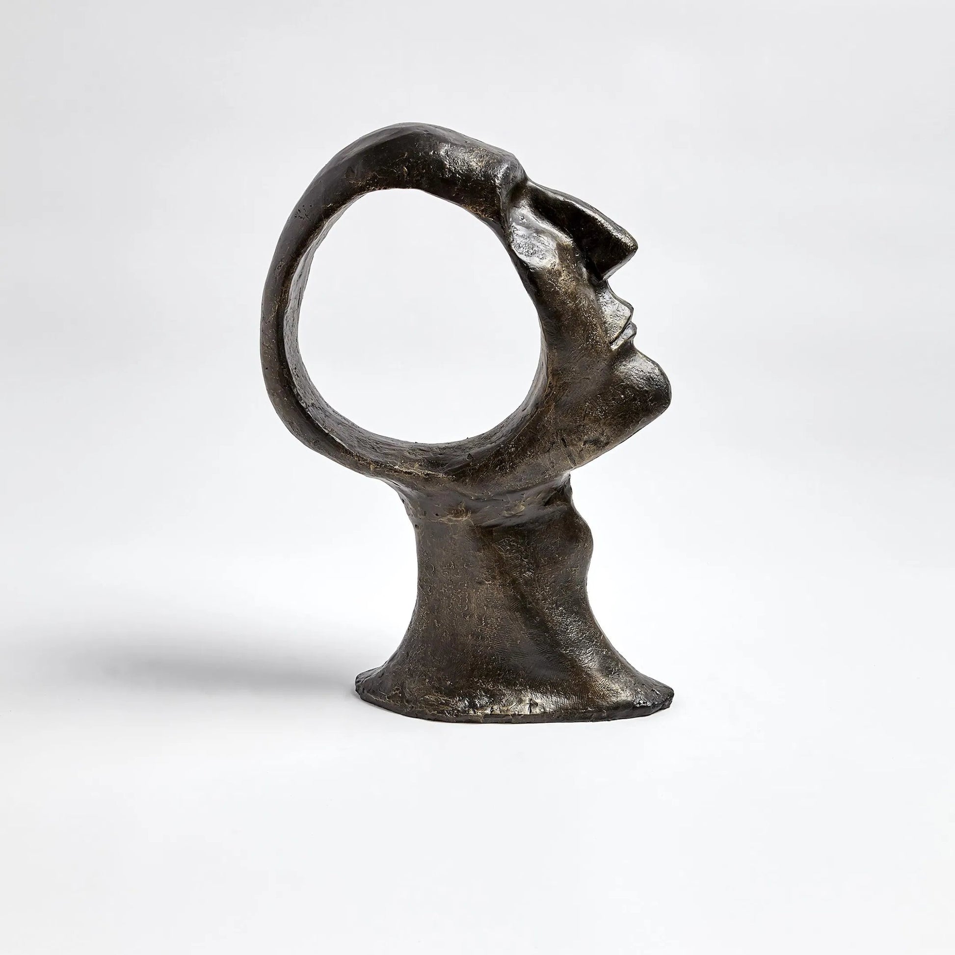 Hollow Head Man by Global Views in bronze. Made from iron in a eclectic & global style.