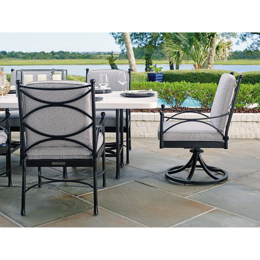 Pavlova Swivel Rocker Dining Chair by Tommy Bahama Outdoor in graphite. Made from aluminum, fabric in a coastal style.