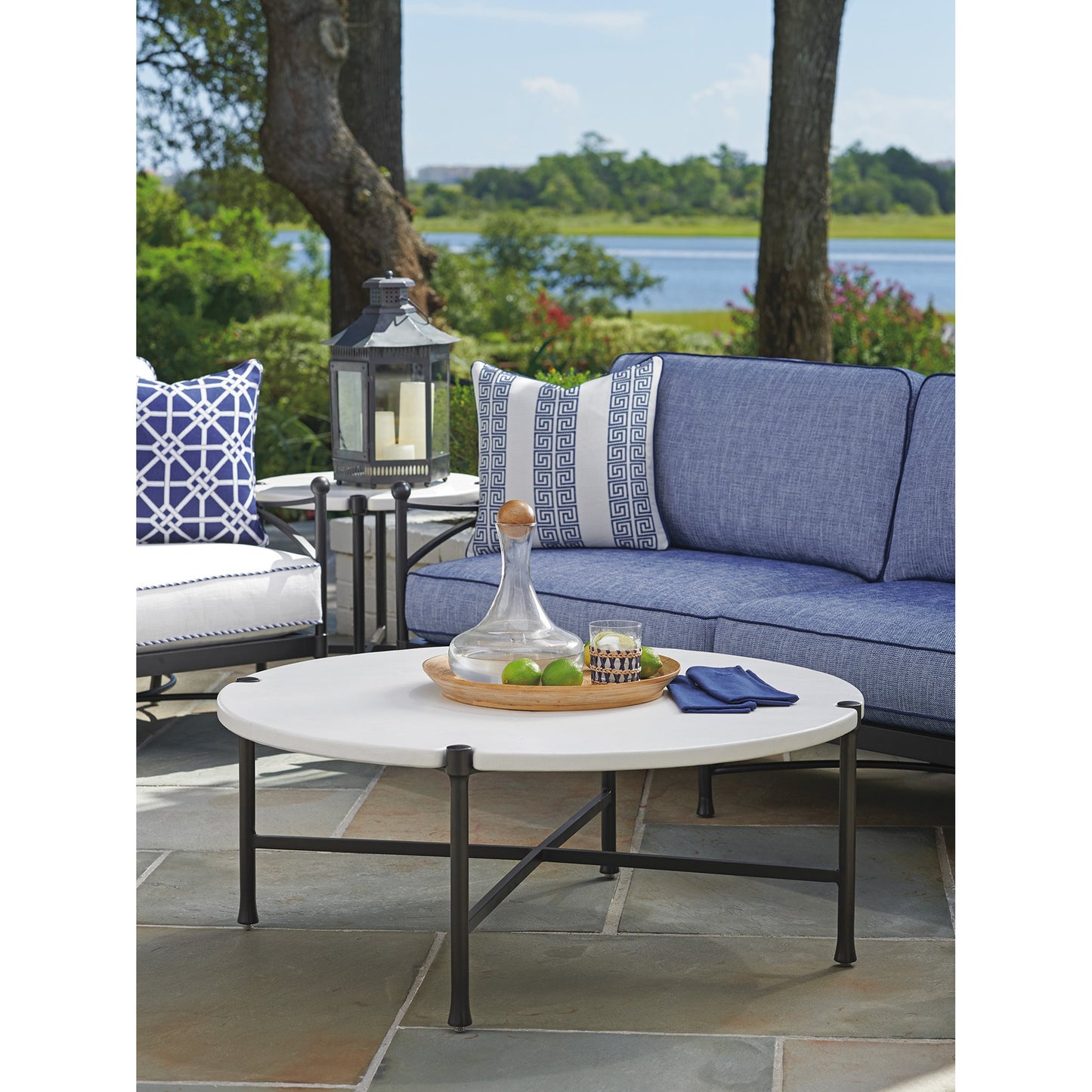 006 SR-836753 | Lifestyle | Pavlova Round Cocktail Table by Tommy Bahama Outdoor in textured graphic white. Made from unique in a transitional style.