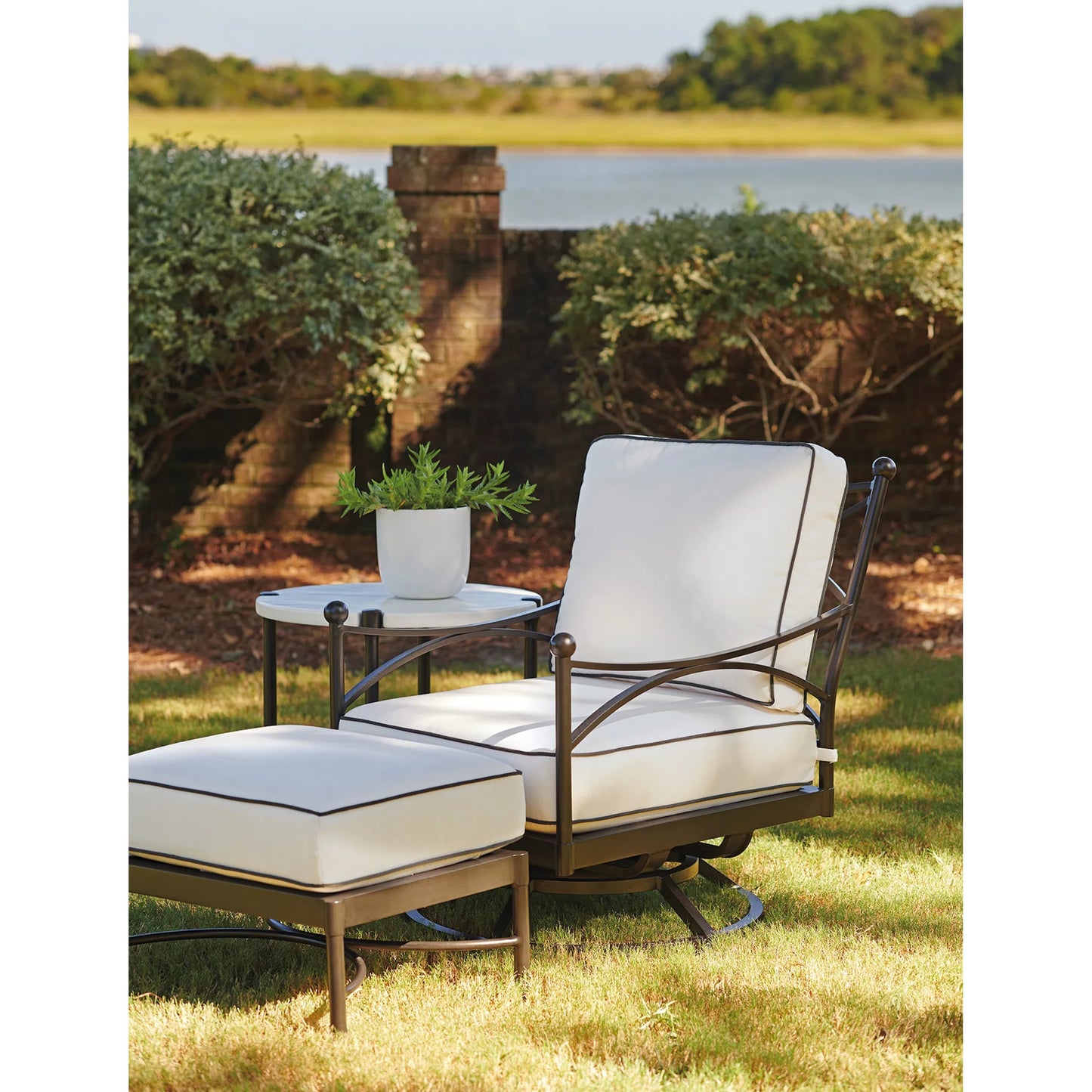 003 SI-2540694 | Lifestyle | Pavlova Swivel Lounge Chair by Tommy Bahama Outdoor in white and graphite. Made from aluminum, fabric in a unique style.