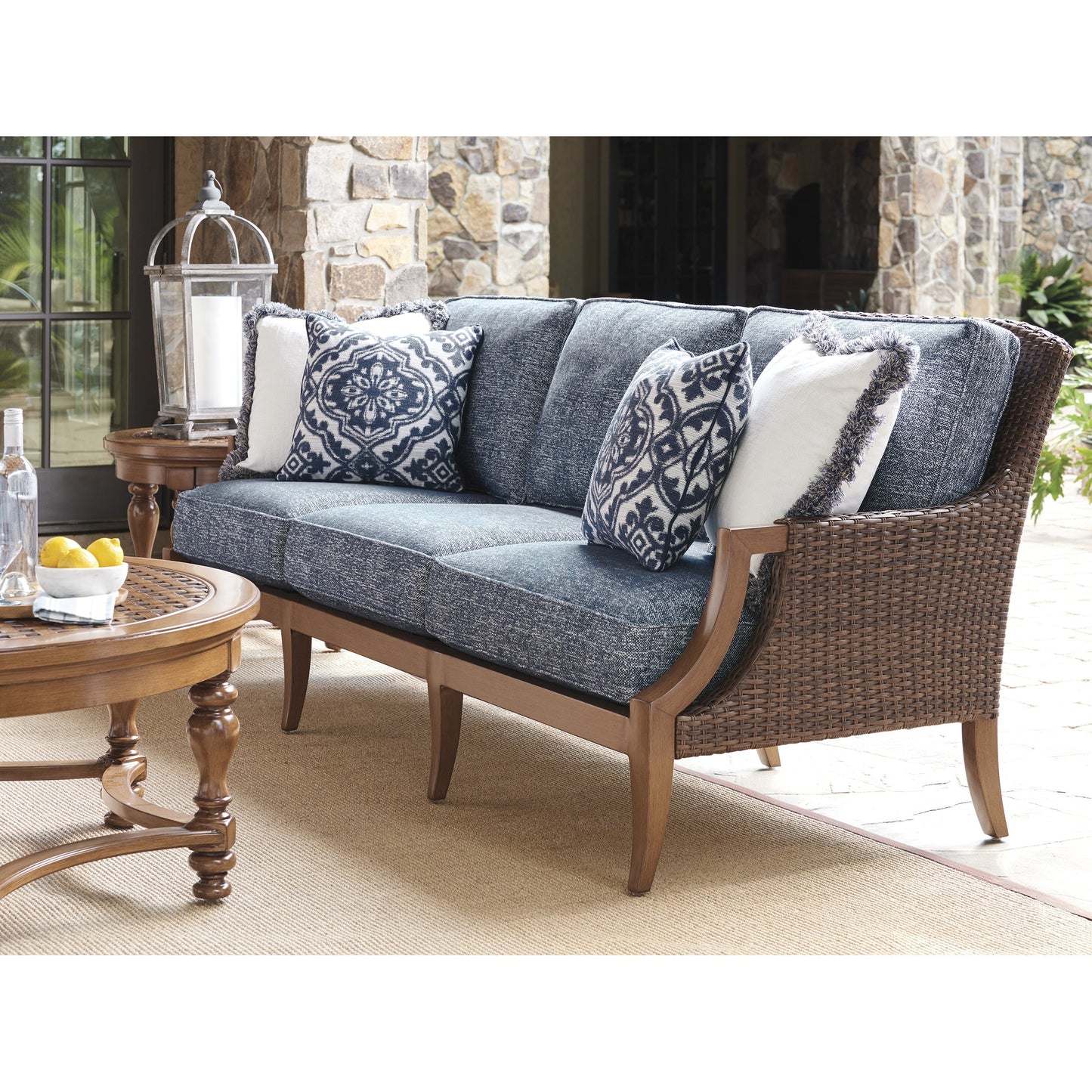 003 SR-836794 | Lifestyle | Harbor Isle Sofa by Tommy Bahama Outdoor in blue and walnut. Made from unique in a coastal style.