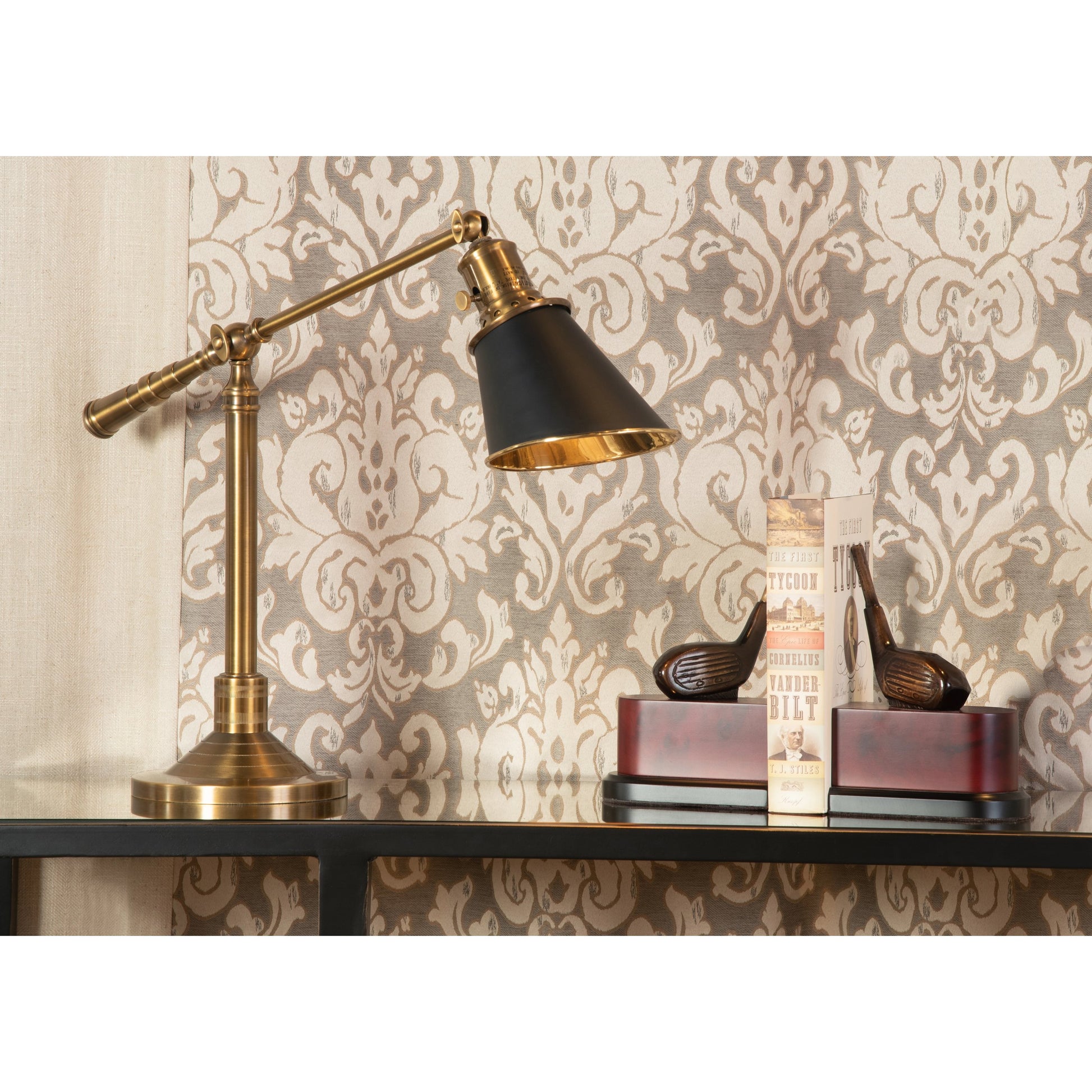 Driver Bookends (Set of 2) by Wildwood in antique patina, brown, black. Made from antique patina on cast brass in a modern style.