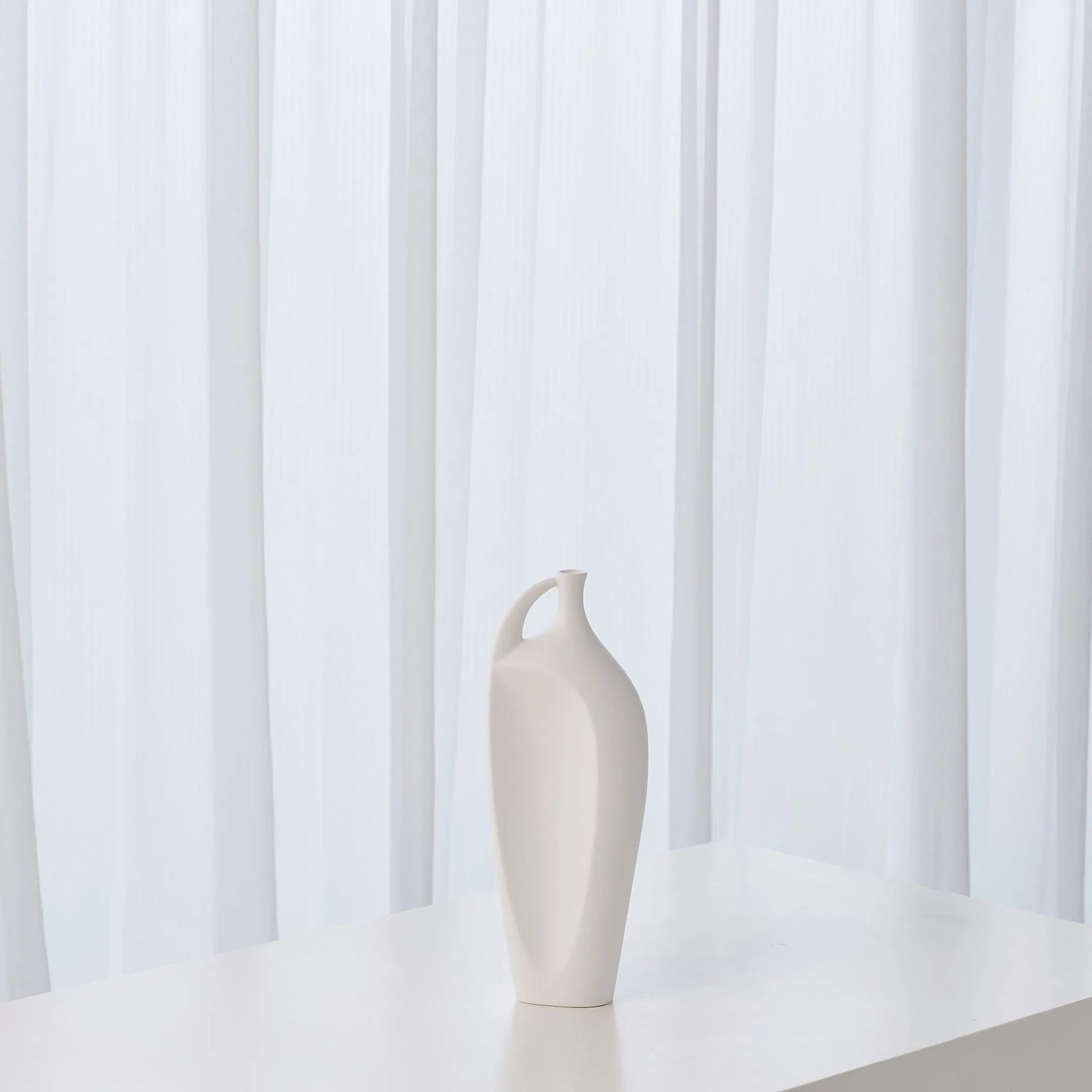 Indentation Vase by Global Views in matte white. Made from ceramic in a modern style.