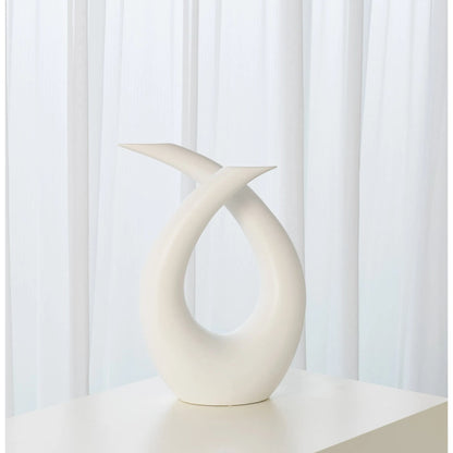 Loop Sculpture by Global Views. Made from ceramic in a modern style.