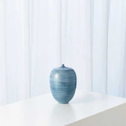 Fat Bottle by Global Views. Made from porcelain in a coastal style.