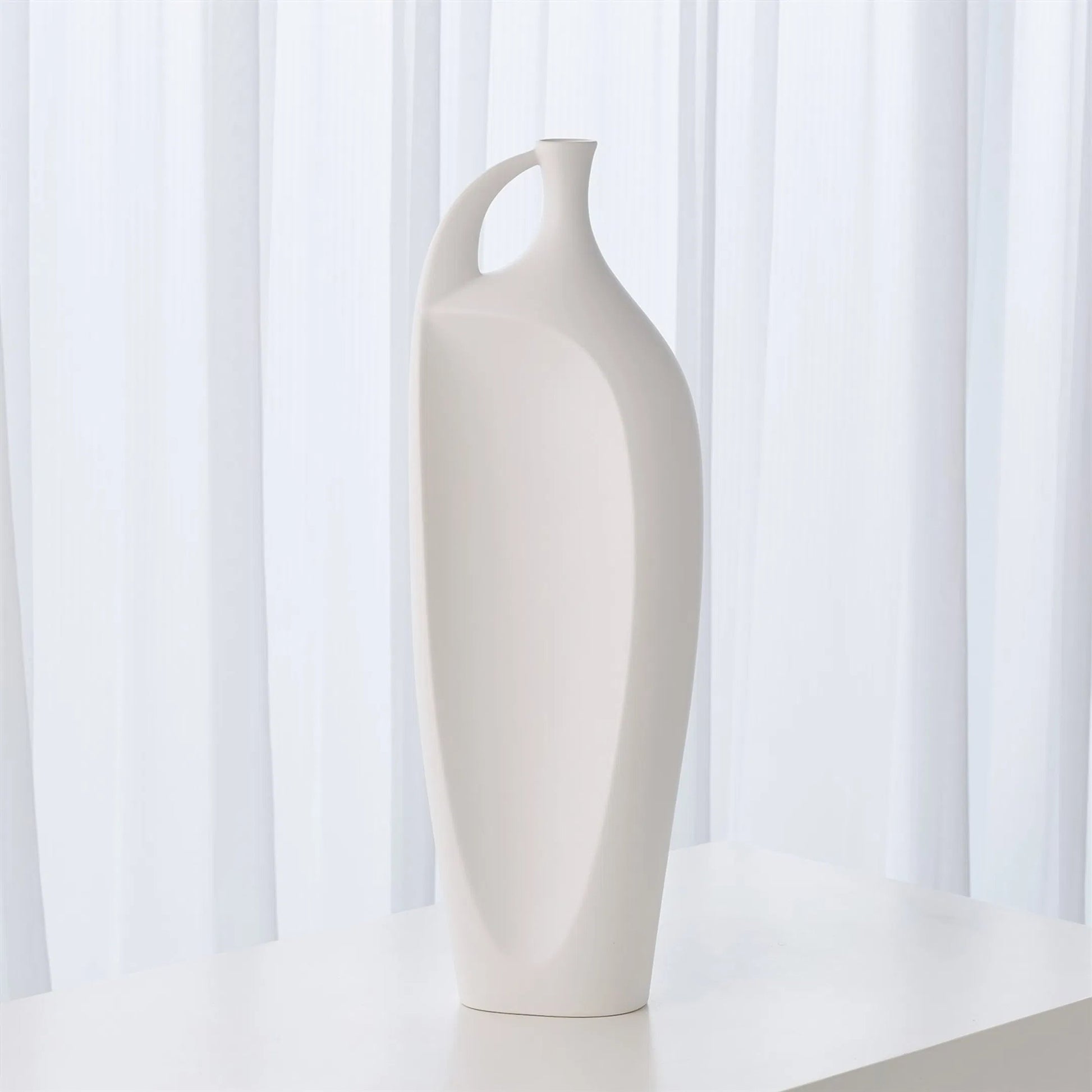 Indentation Vase by Global Views in matte white. Made from ceramic in a modern style.