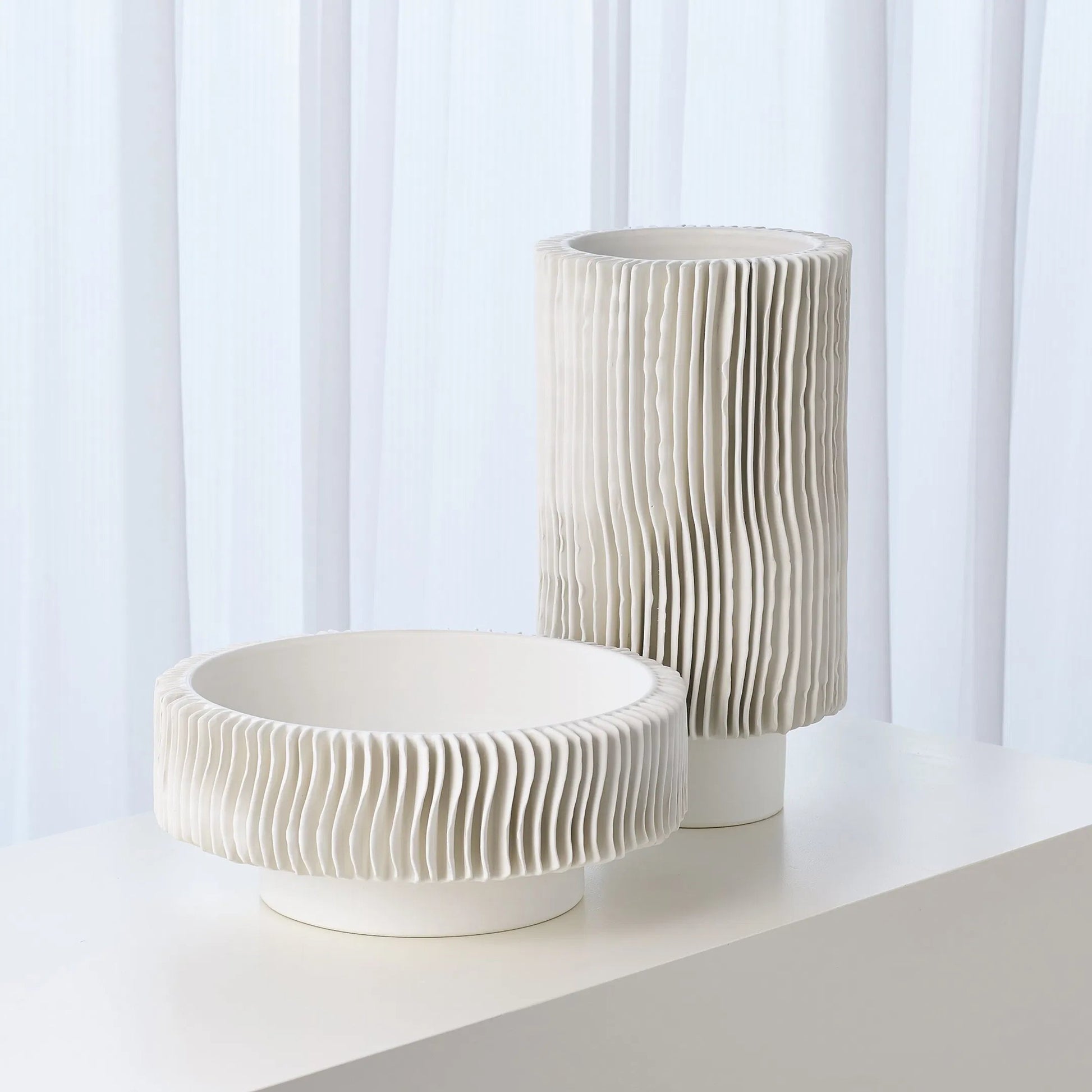 Radiator Vase by Global Views. Made from ceramic in a coastal style.
