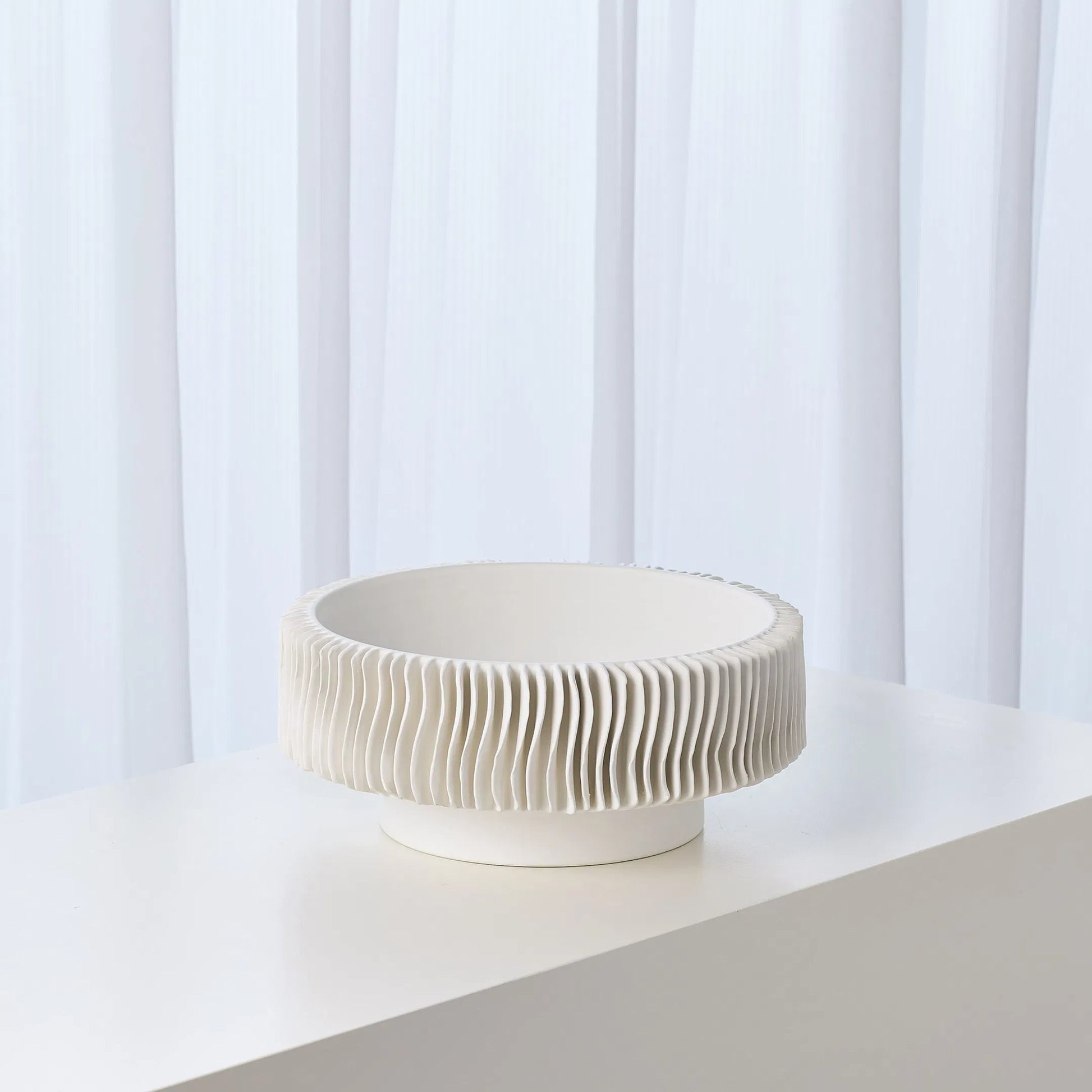 Radiator Vase by Global Views. Made from ceramic in a coastal style.