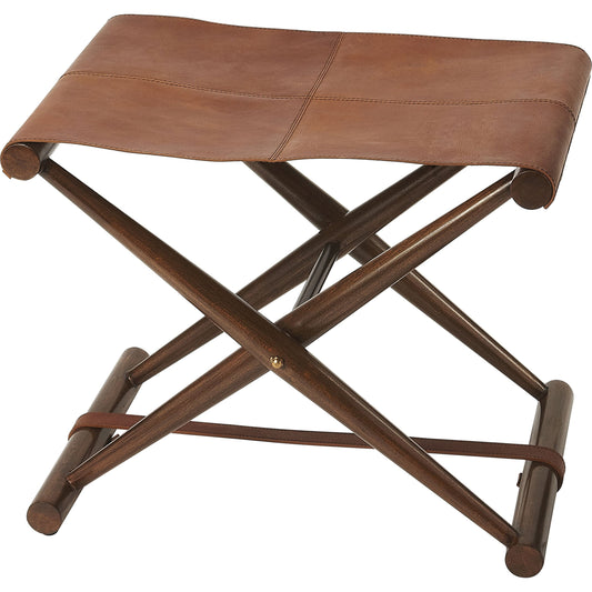 Sutton Leather Folding Stool by Butler Specialty Company in medium brown and butler loft. Made from natural leather, shorea, meranti wood solids in a rustic style.