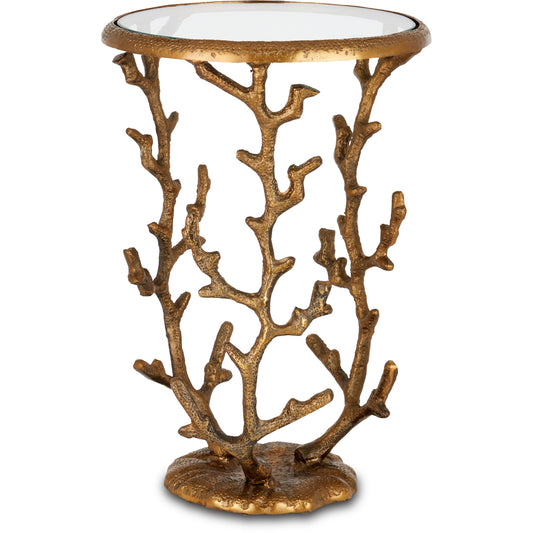 Coral Accent Table by Currey and Company in antique brass, clear. Made from cast aluminum, glass in a modern style.