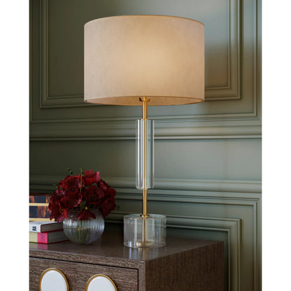 Deville Table Lamp by Currey and Company in clear, antique brass. Made from optic crystal, metal in a modern style.