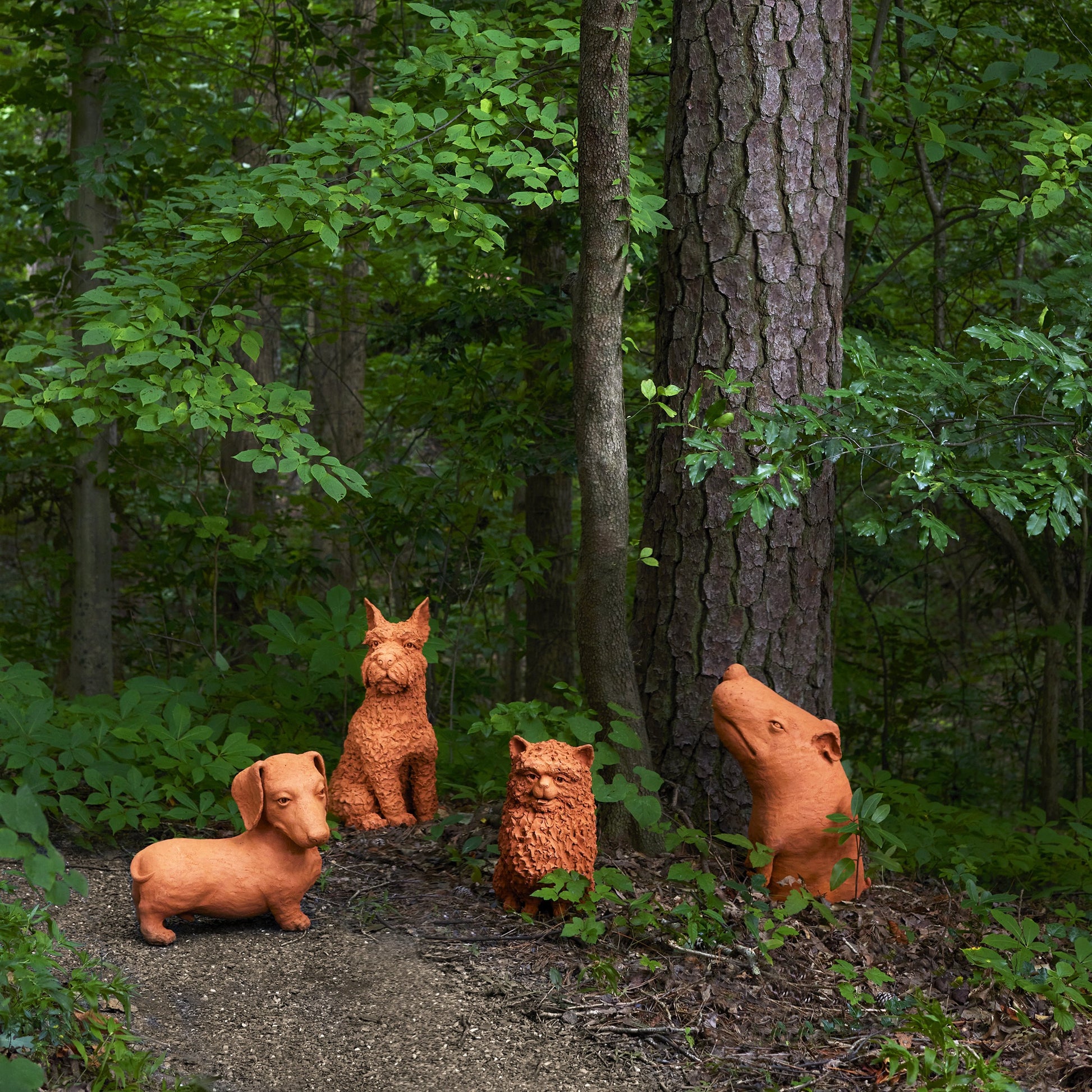 Rocky the Teckel by Currey and Company in natural. Made from terracotta in a cottage & farmhouse style.