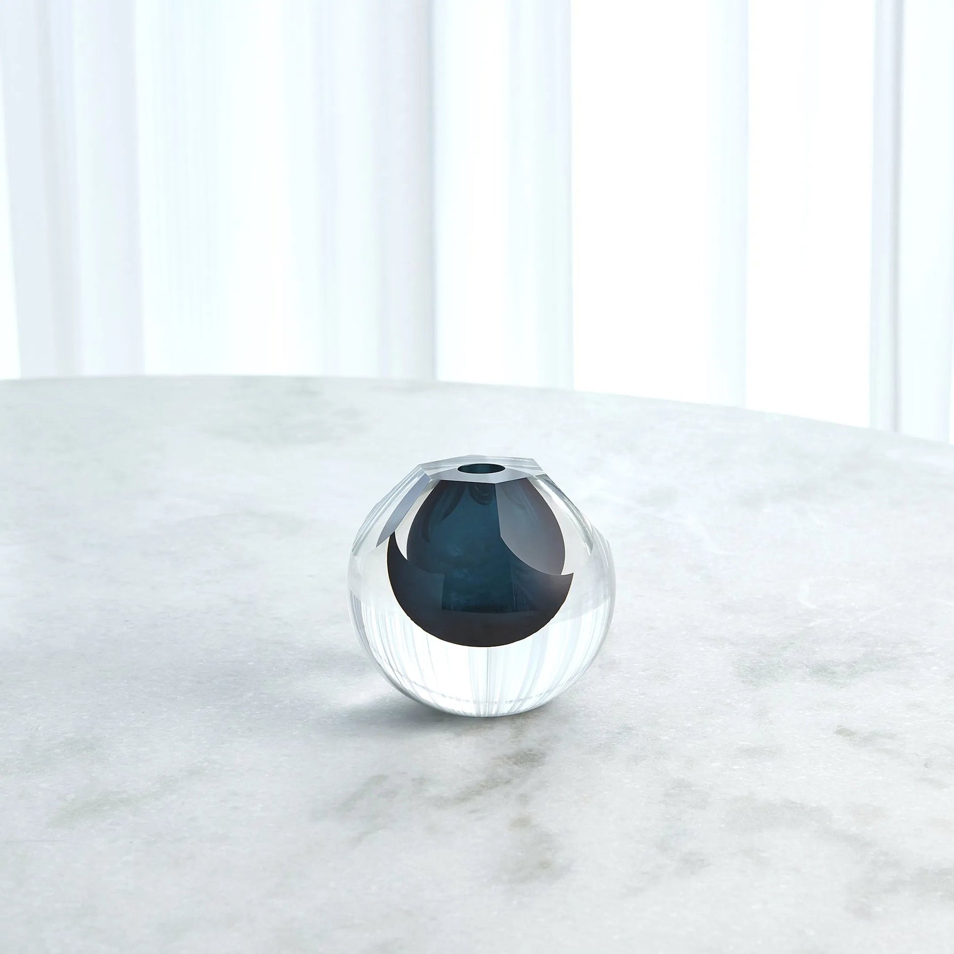 Hexagon Cut Glass Vase by Global Views. Made from art glass in a coastal style.