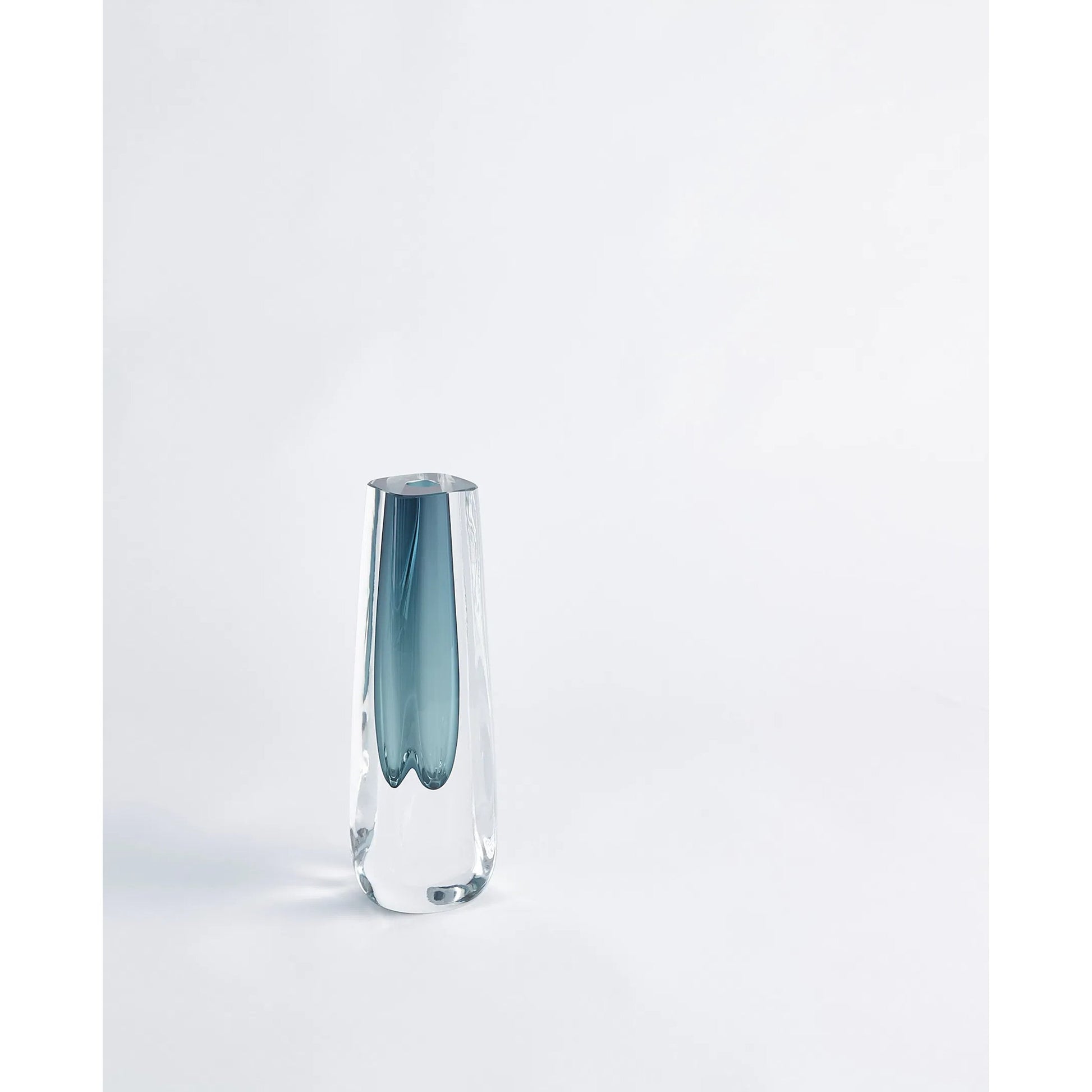 Square Cut Glass Vase by Global Views. Made from art glass in a coastal style.