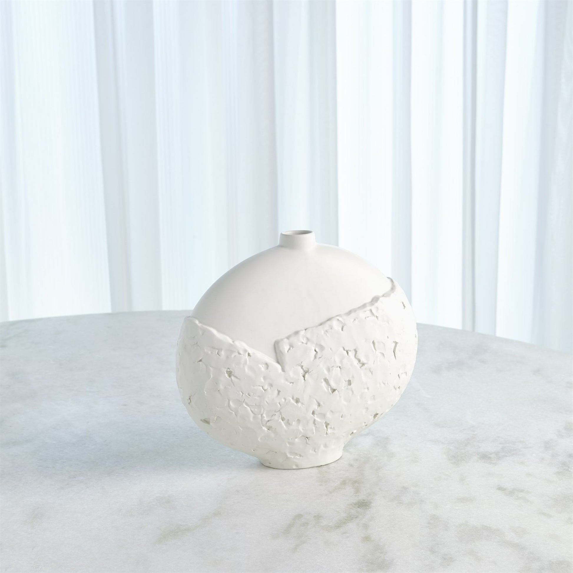 Asymmetrical Stipple Vase by Global Views in matte white. Made from ceramic in a coastal style.