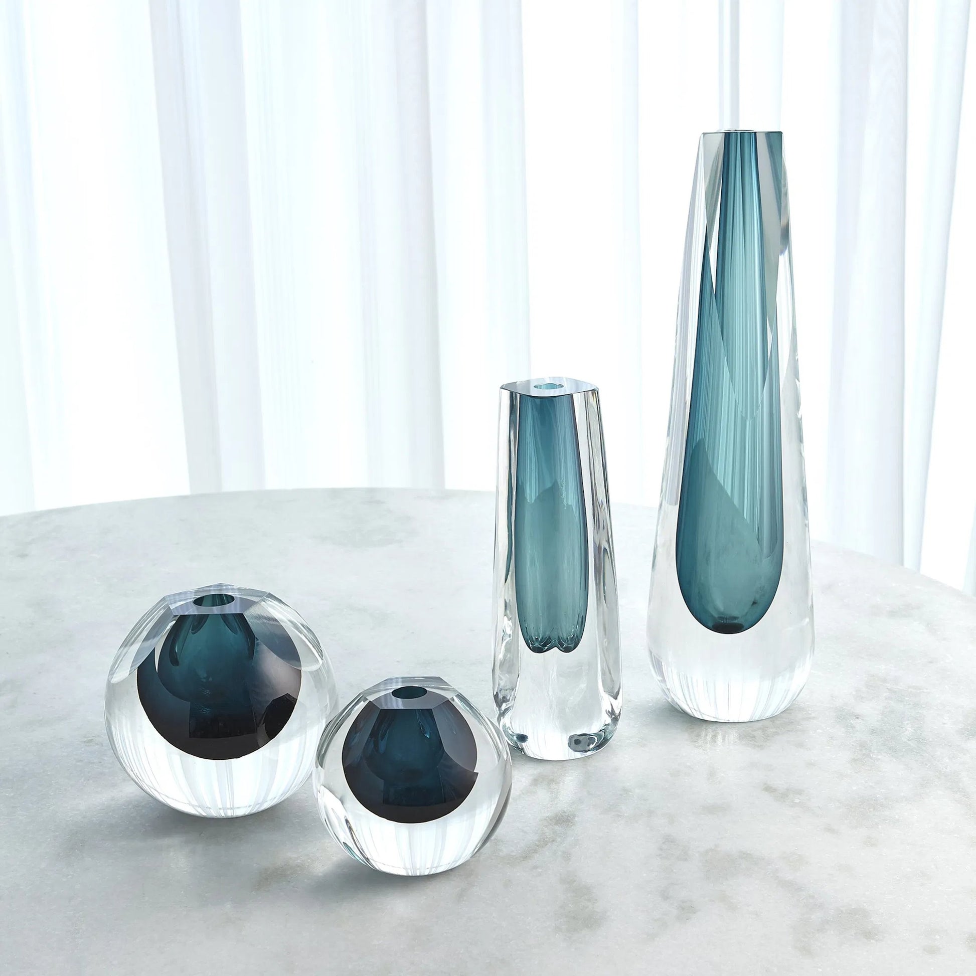 Pentagon Cut Glass Vase by Global Views. Made from art glass in a coastal style.