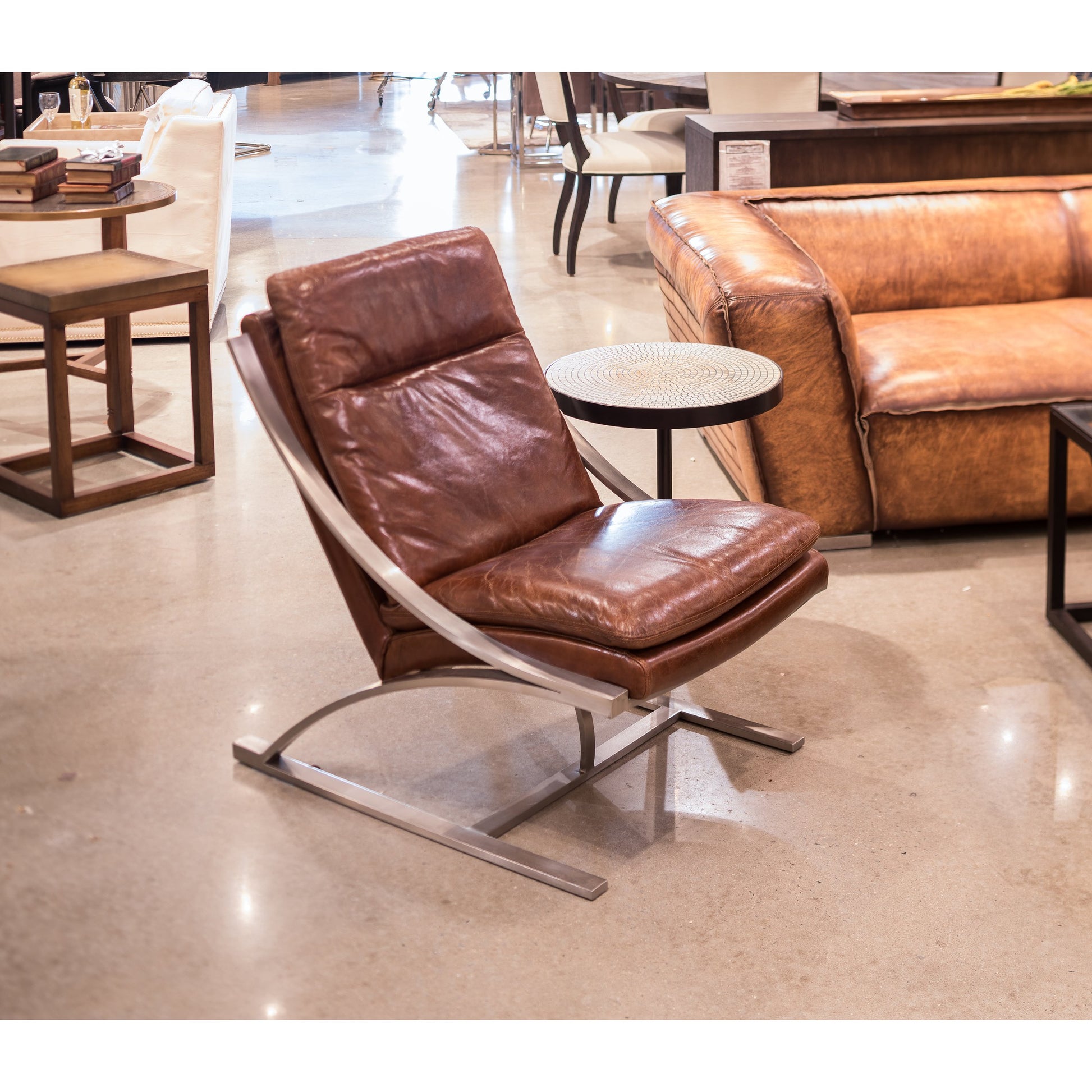 Mc Queen Chair by Sarreid Ltd. in brown and vintage cigar leather. Made from leather in a modern style.