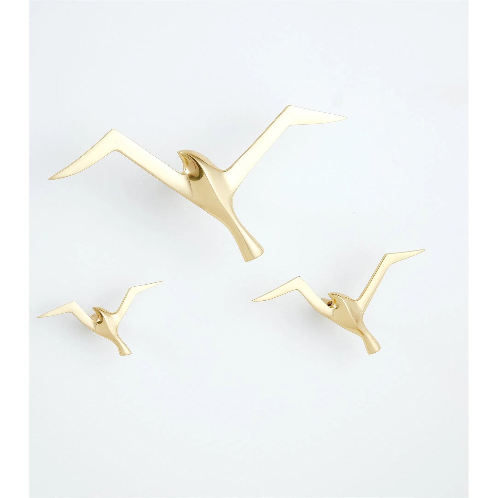 Flock Wall Decor by Global Views. Made from brass in a coastal style.