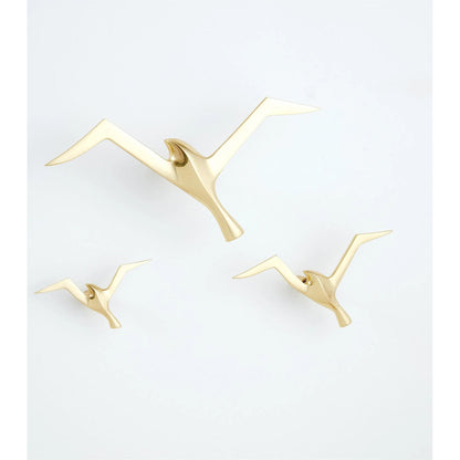 Flock Wall Decor by Global Views. Made from brass in a coastal style.