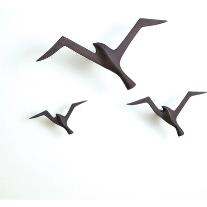 Flock Wall Decor by Global Views. Made from brass in a coastal style.