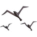 Flock Wall Decor by Global Views. Made from brass in a coastal style.