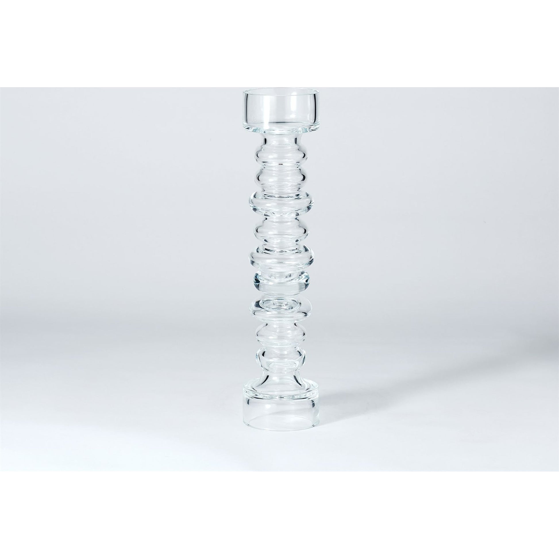 Glass Ribbed Candleholder by Global Views. Made from glass in a transitional style.