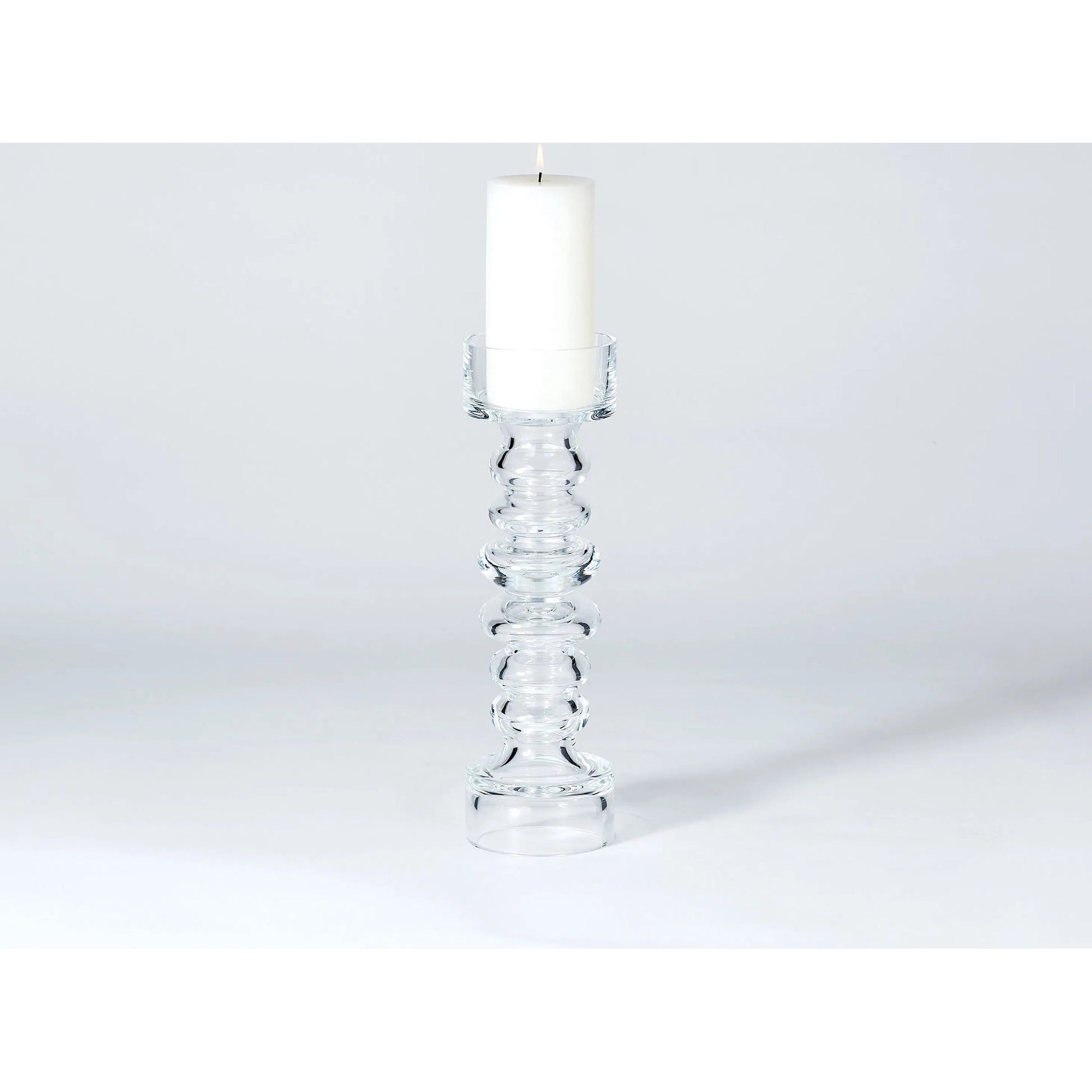 Glass Ribbed Candleholder by Global Views. Made from glass in a transitional style.