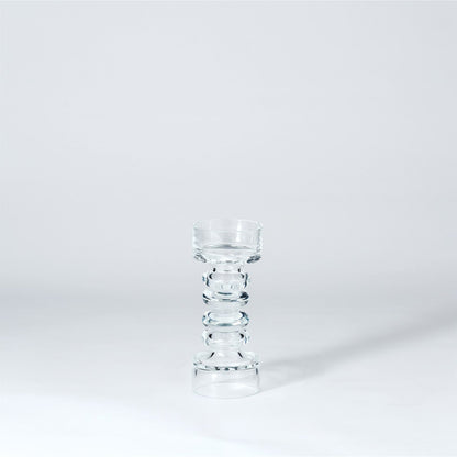 Glass Ribbed Candleholder by Global Views. Made from glass in a transitional style.