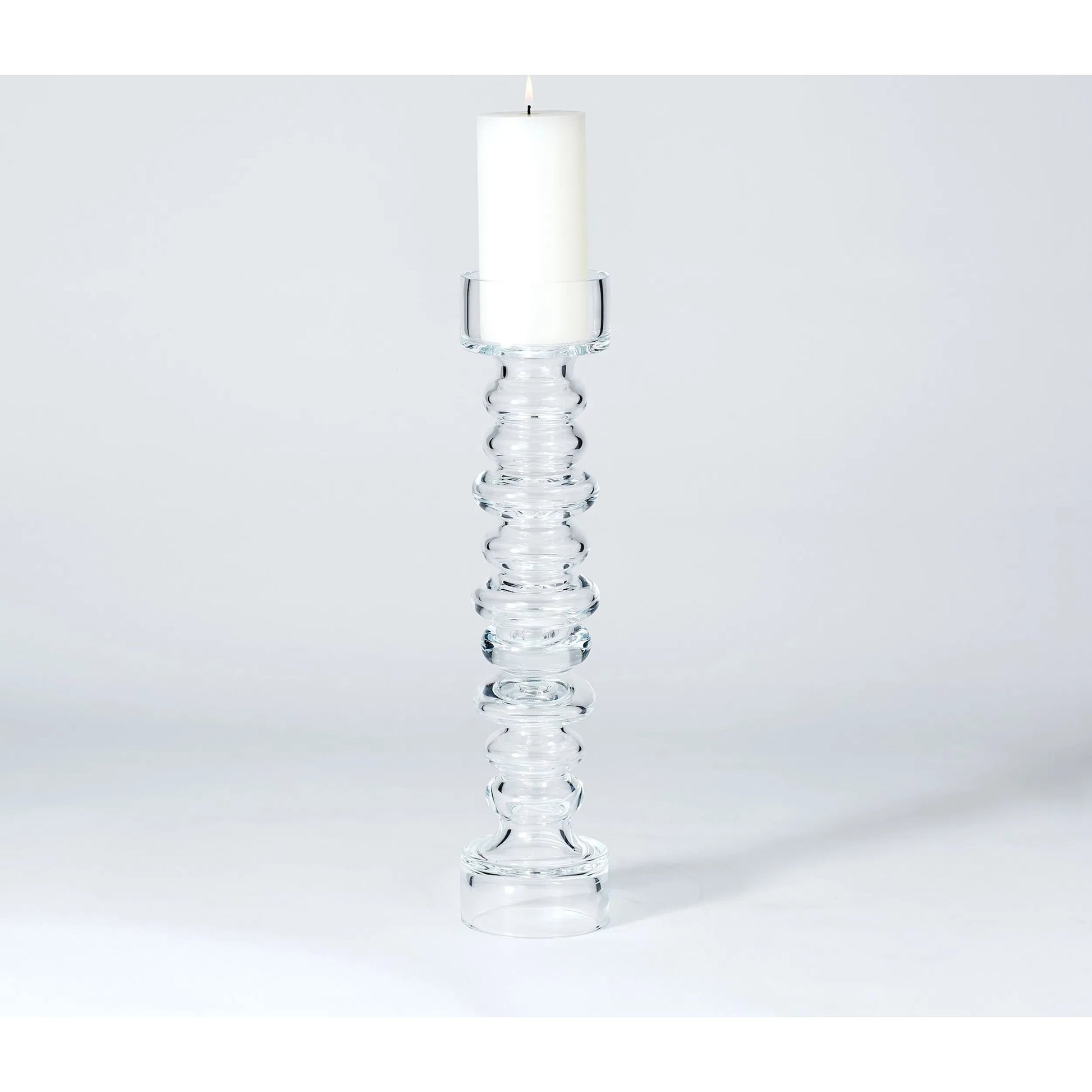 Glass Ribbed Candleholder by Global Views. Made from glass in a transitional style.