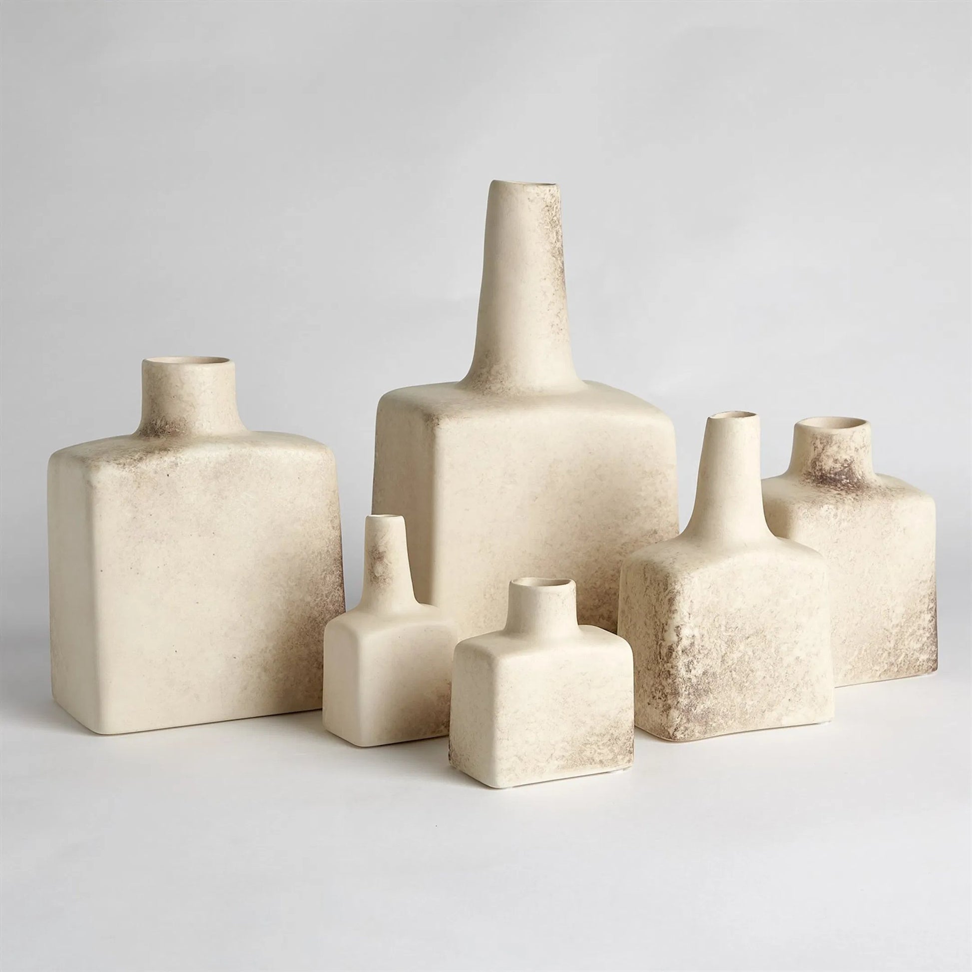 Tall Stack Bottle by Global Views in reactive ivory. Made from earthenware in a eclectic & global style.