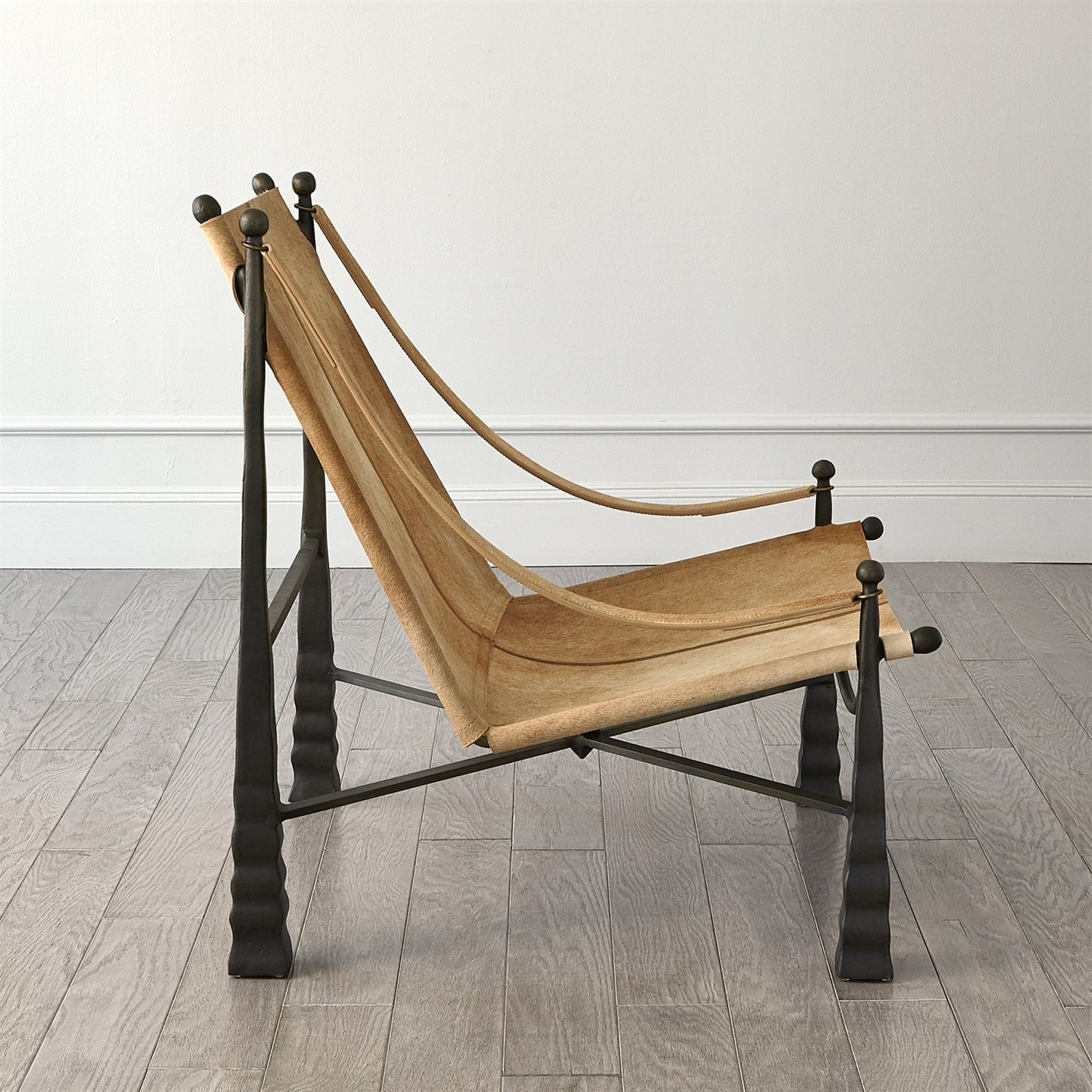 Cognac Chair by Global Views. Made from metal, cowhide in a rustic style.