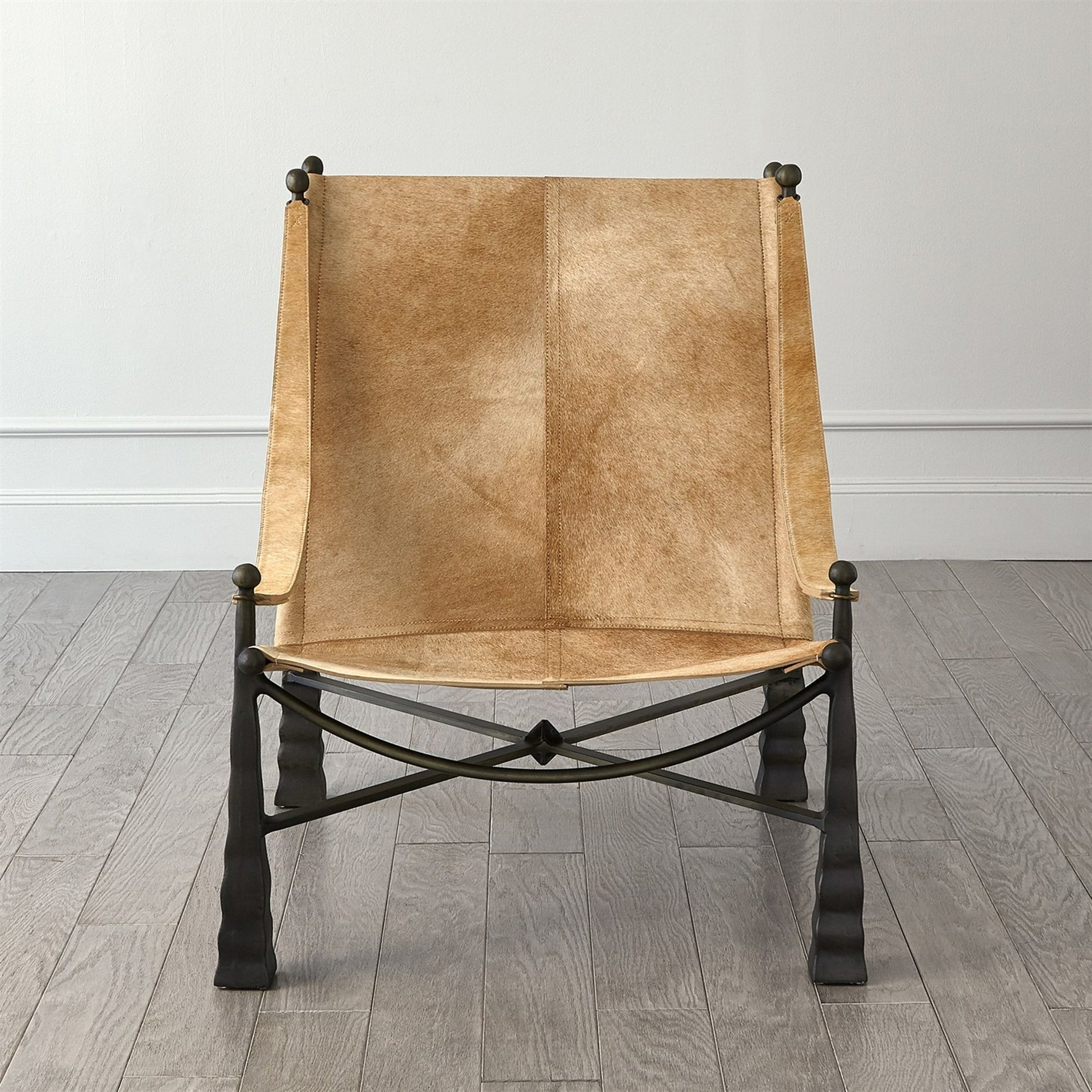 Cognac Ottoman by Global Views. Made from metal, cowhide in a rustic style.