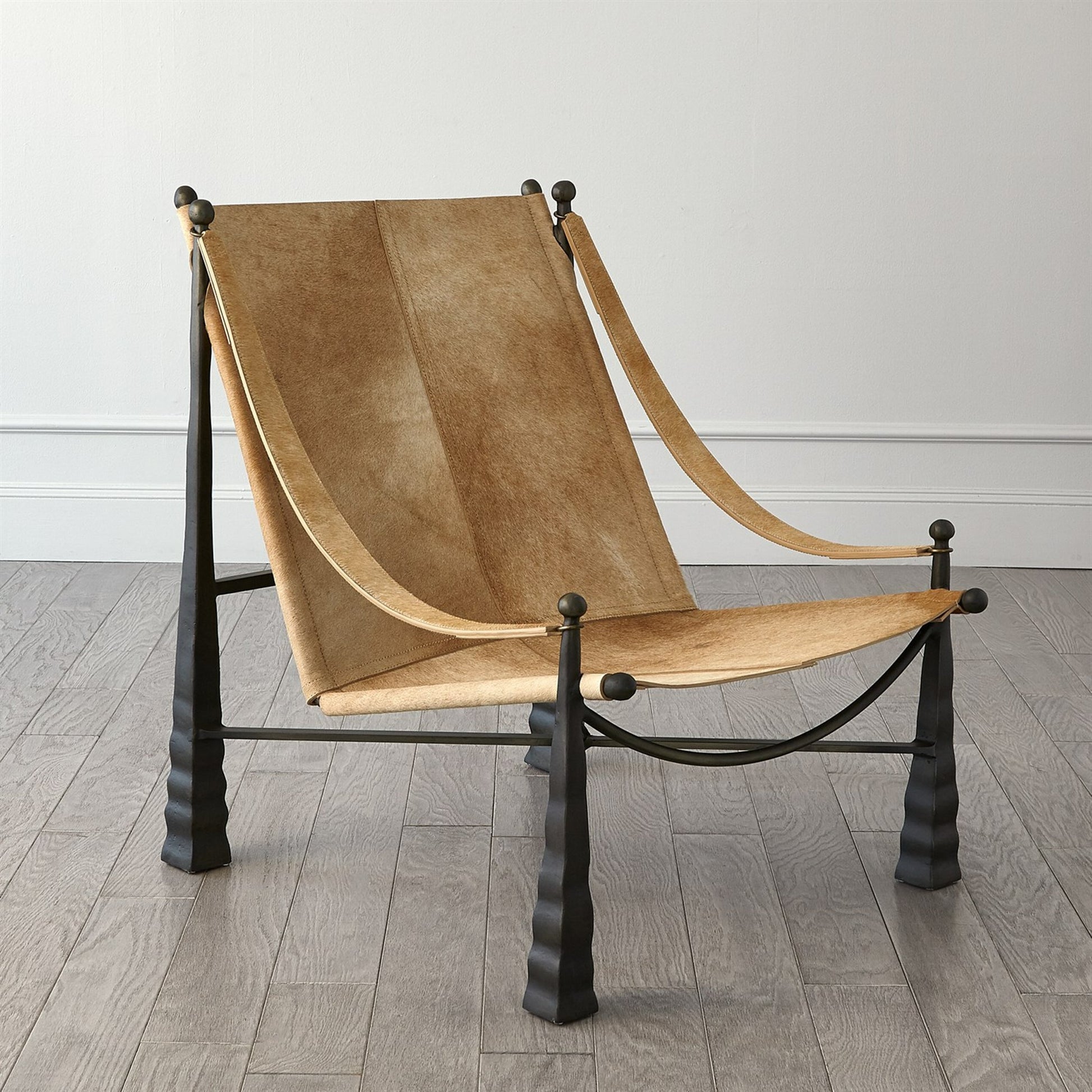 Cognac Ottoman by Global Views. Made from metal, cowhide in a rustic style.